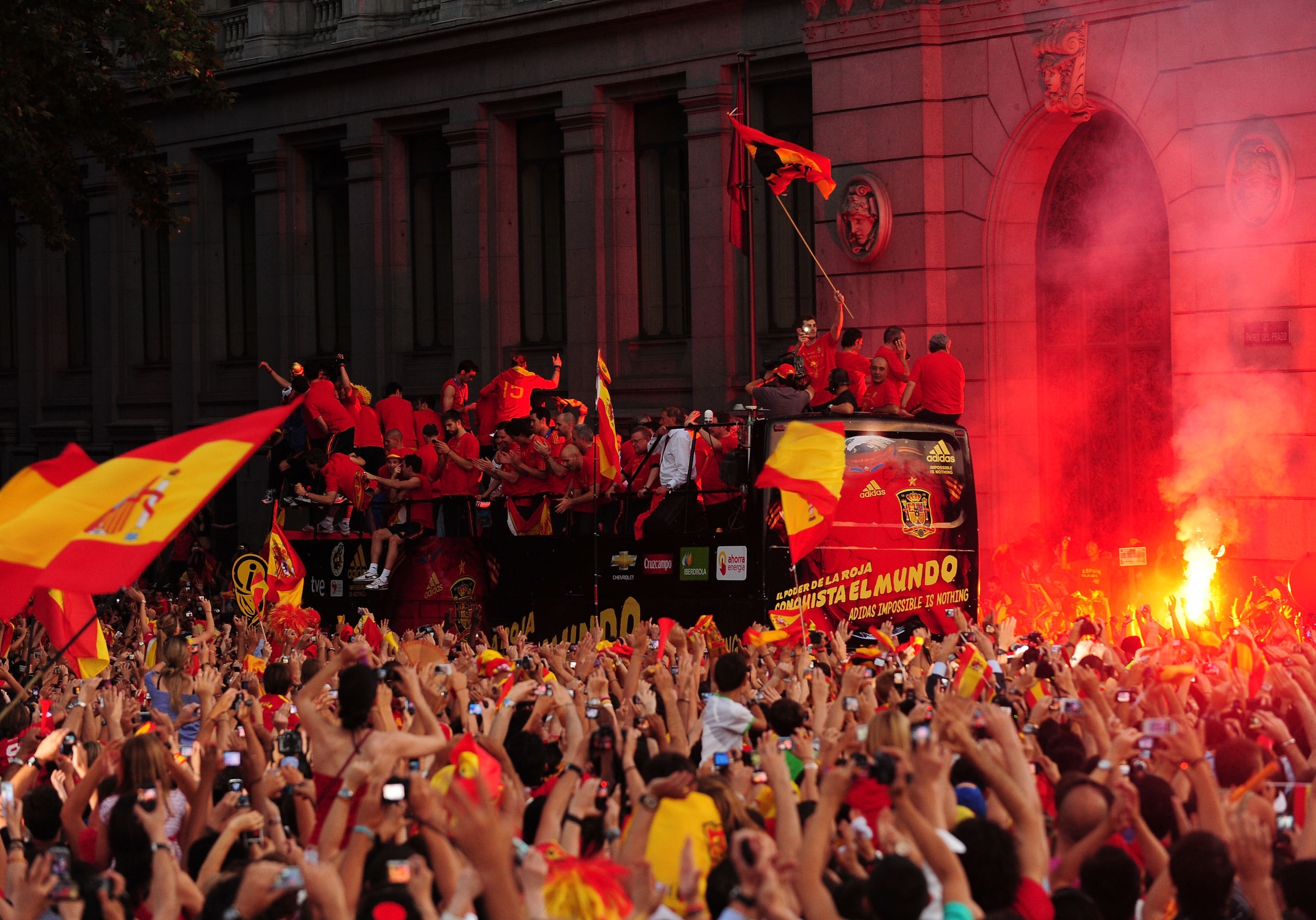 MADRID, SPAIN - JULY 12: Crowds cheer for the Spanish team as they travel in an open bus as part of the FIFA 2010 World Cup victory parade in Plaza Cibeles on July 12, 2010 in Madrid, Spain. (Photo by Denis Doyle/Getty Images) MADRID, SPAIN - JULY 12: Crowds cheer for the Spanish team as they travel in an open bus as part of the FIFA 2010 World Cup victory parade in Plaza Cibeles on July 12, 2010 in Madrid, Spain. (Photo by Denis Doyle/Getty Images)