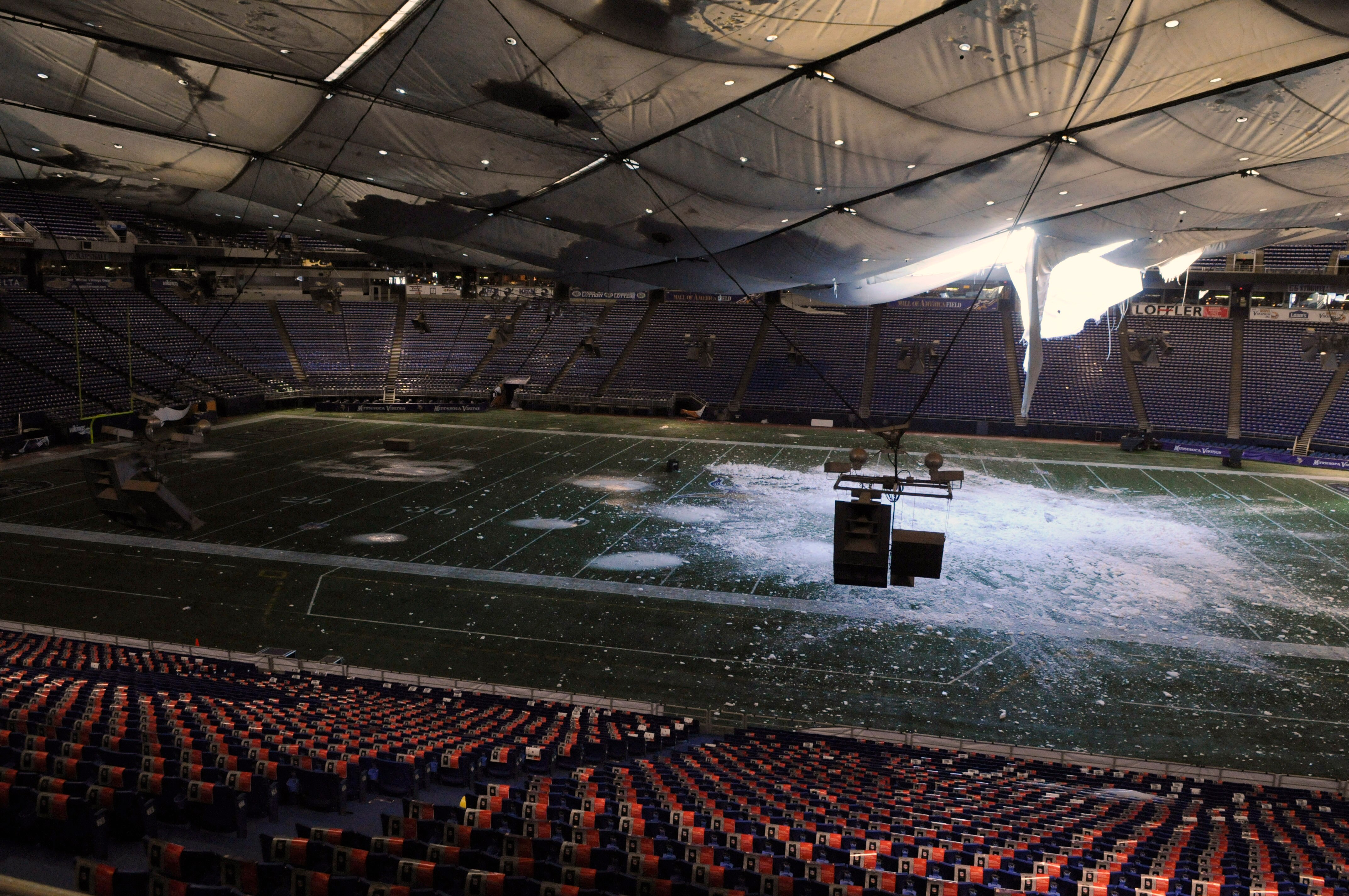MINNEAPOLIS, MN - DECEMBER 13: A torn section of the roof sags inside the Hubert H. Humphrey Metrodome on December 13, 2010 in Minneapolis, Minnesota. The Metrodome's roof collapsed under the weight of snow after a powerful blizzard hit the area on Decemb
