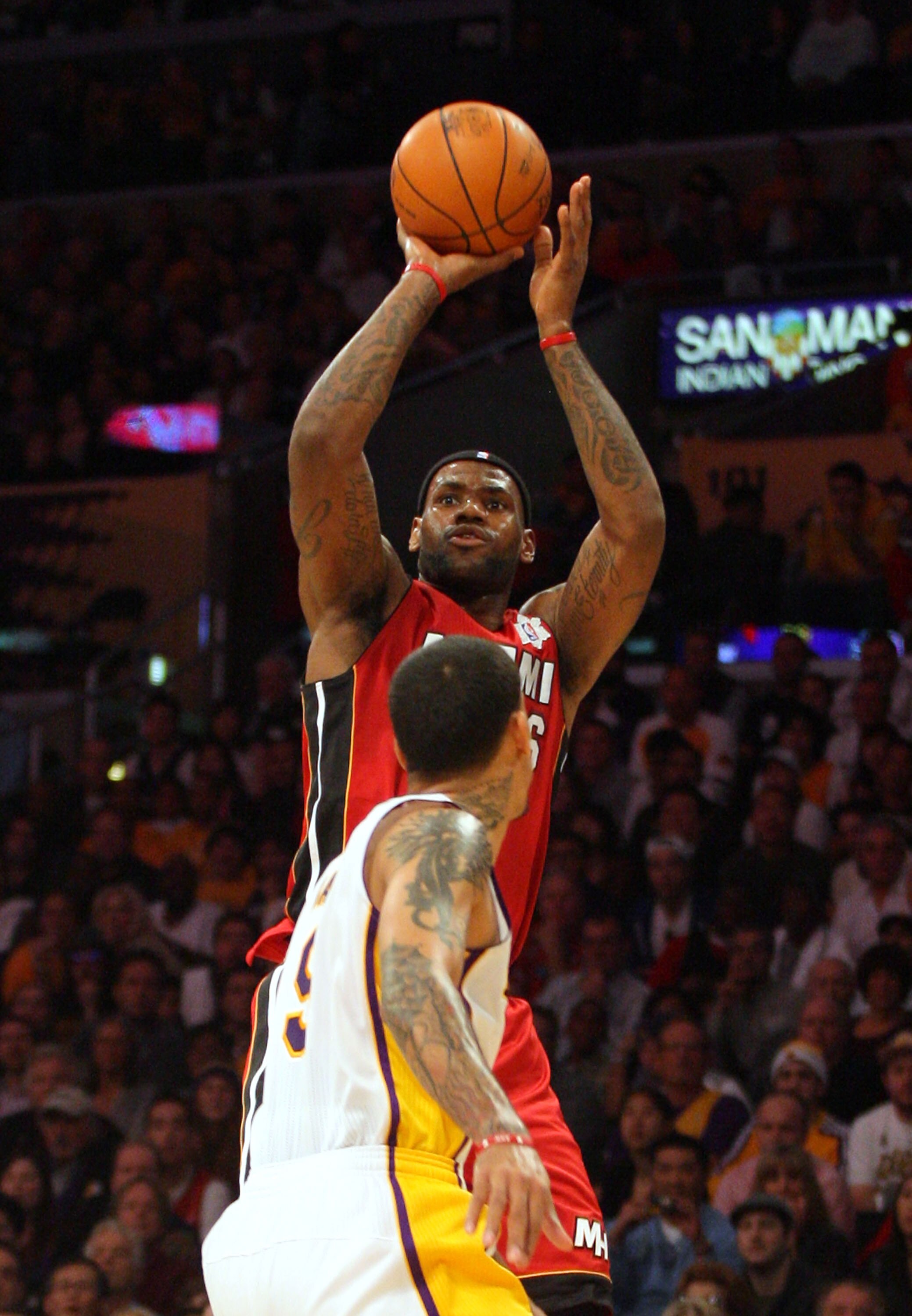 LOS ANGELES, CA - DECEMBER 25: LeBron James #6 of the Miami Heat shoots the jump shot against Matt Barnes #9 of the Los Angeles Lakers during the NBA game at Staples Center on December 25, 2010 in Los Angeles, California. The Heat defeated the Lakers 96-8