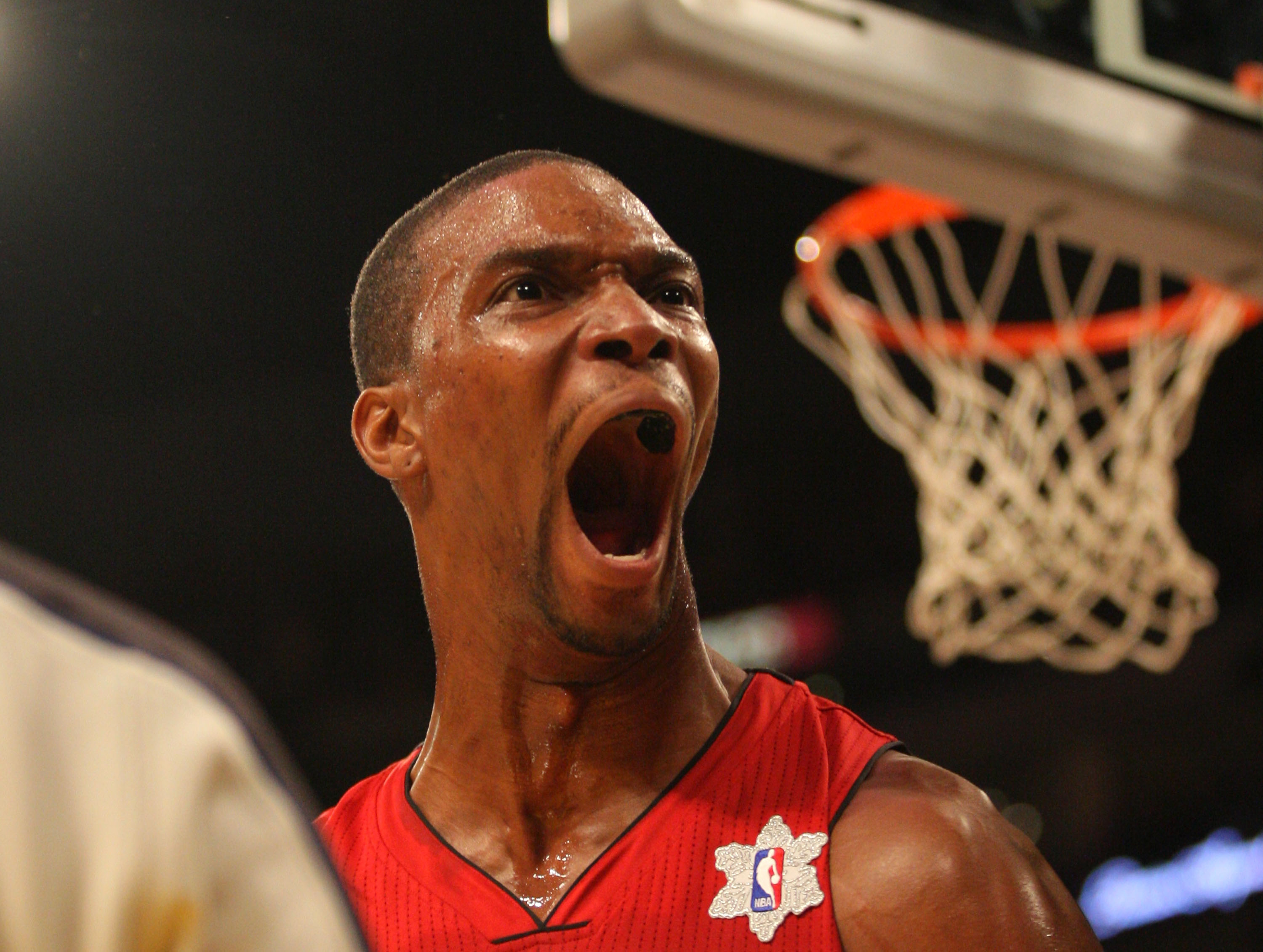 LOS ANGELES, CA - DECEMBER 25: Chris Bosh #1 of the Miami Heat reacts after making a basket against the Los Angeles Lakers during the NBA game at Staples Center on December 25, 2010 in Los Angeles, California. (Photo by Victor Decolongon/Getty Images)
