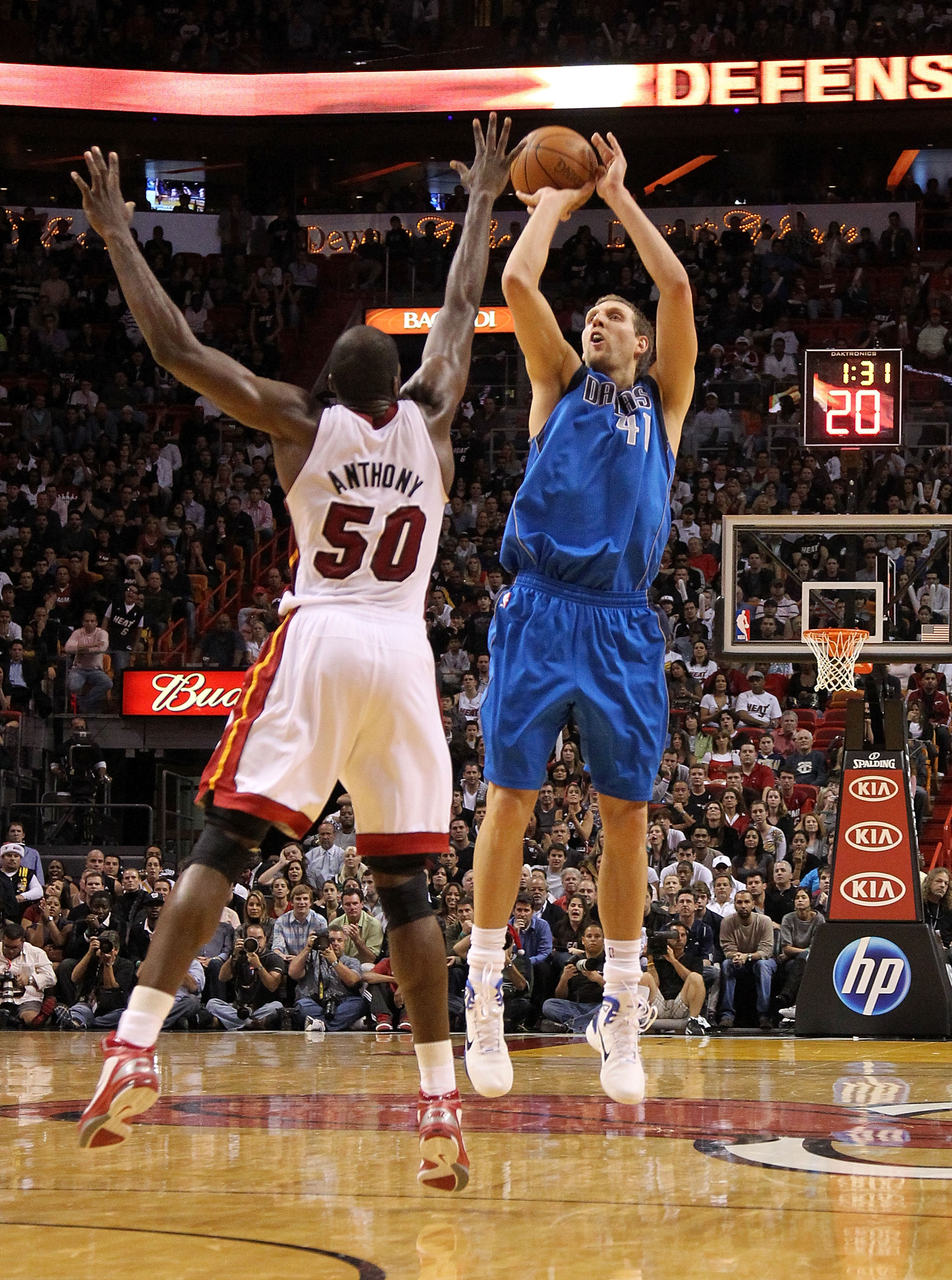MIAMI, FL - DECEMBER 20:  Dirk Nowitzki #41 of the Dallas Mavericks shoots over Joel Anthony #50 of the Miami Heat during a game at American Airlines Arena on December 20, 2010 in Miami, Florida. NOTE TO USER: User expressly acknowledges and agrees that,