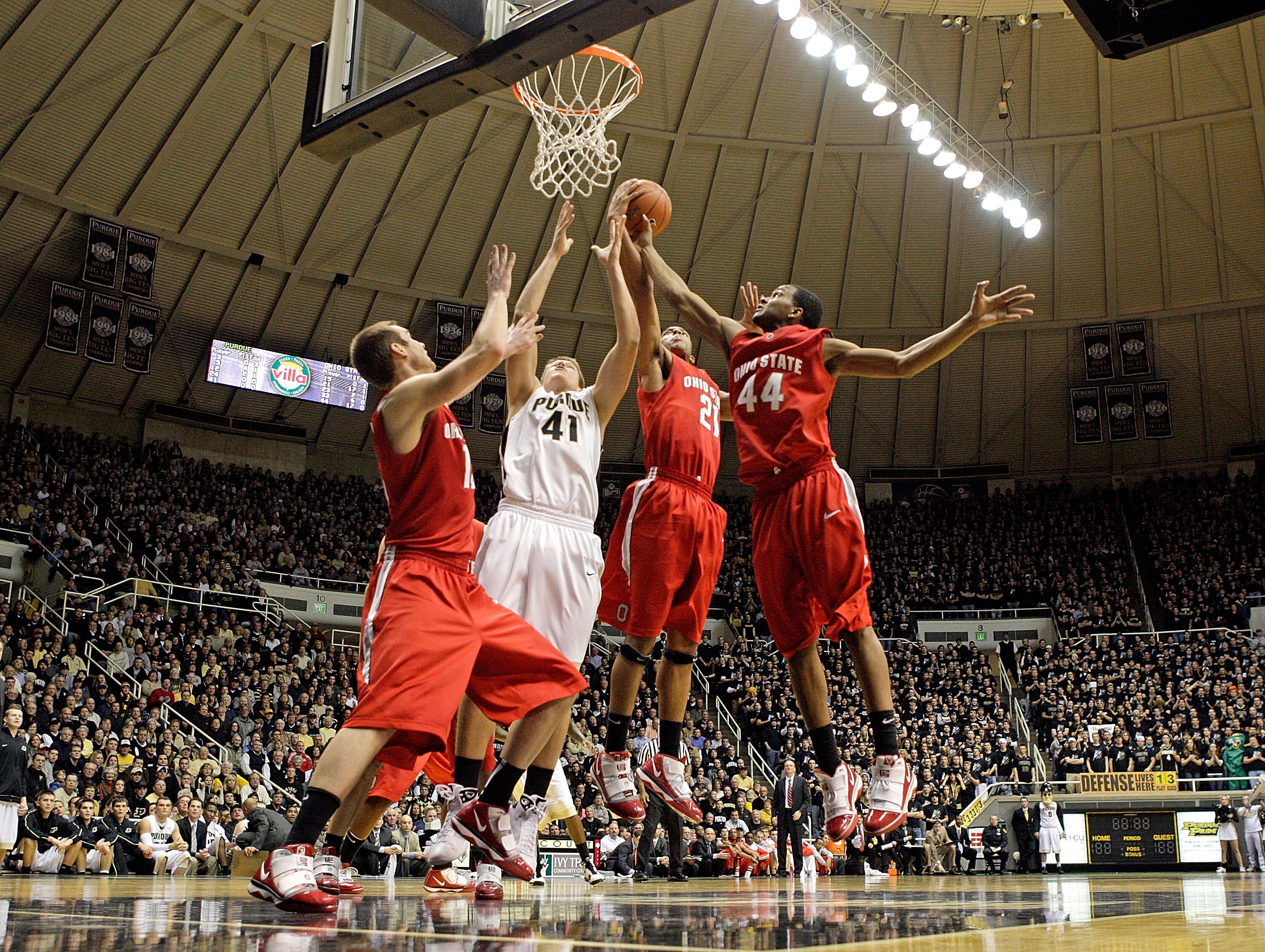 WEST LAFAYETTE, IN - JANUARY 12:  Kyle Madsen #15, Evan Turner #21 and  William Buford #44 of the Ohio State Buckeyes and Patrick Bade #41of the Purdue Boilermakers reach for a rebound during the Big Ten game at Mackey Arena on January 12, 2010 in West La
