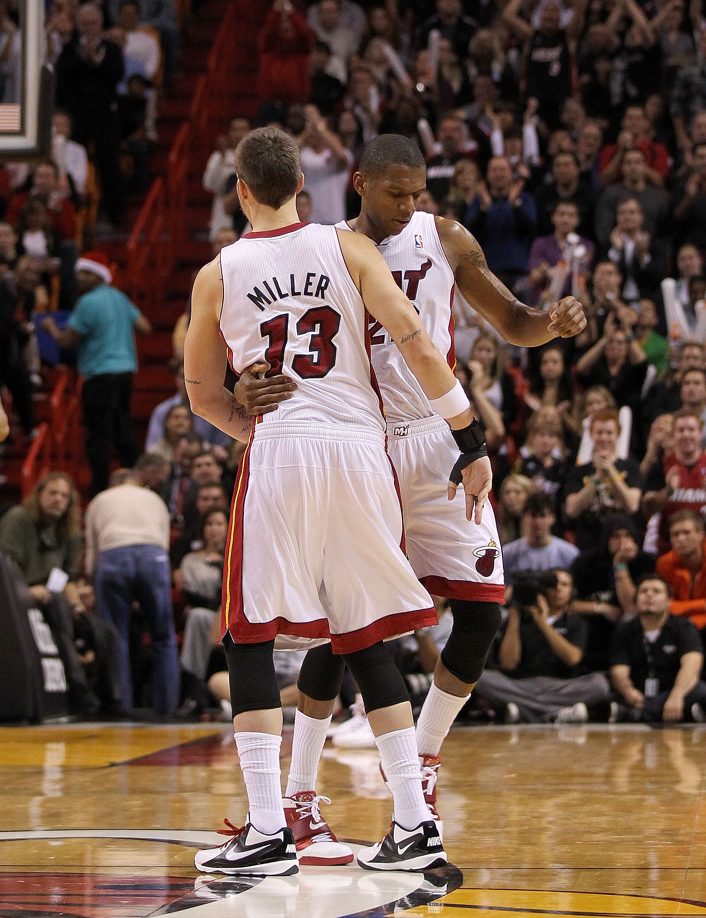 MIAMI, FL - DECEMBER 20: Mike Miller #13 of the Miami Heat is hugged by James Jones #22 after coming back for the first time from an injury during a game against the Dallas Mavericks at American Airlines Arena on December 20, 2010 in Miami, Florida. NOTE