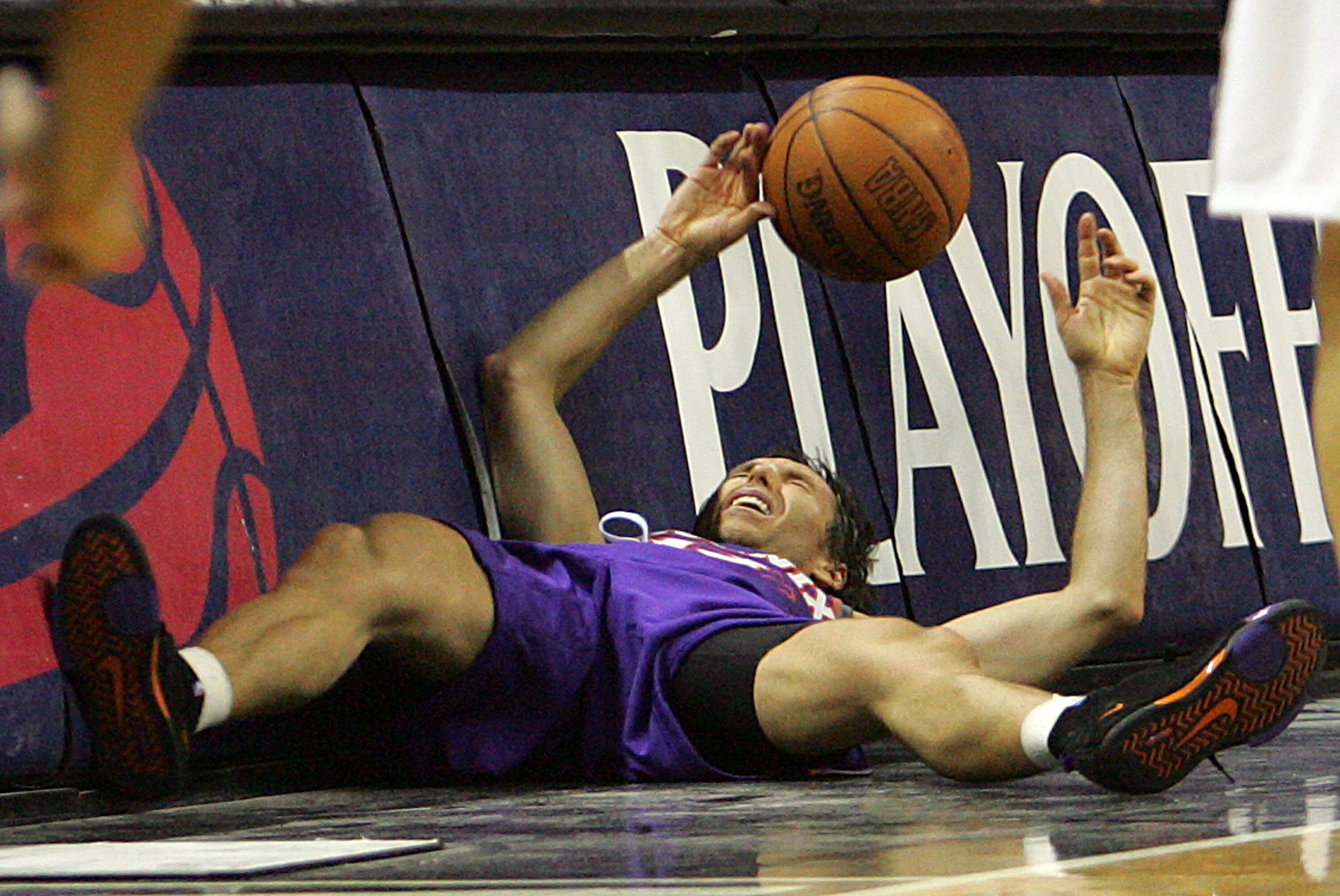 SAN ANTONIO - MAY 14:  Guard Steve Nash #13 of the Phoenix Suns falls out of bounds after a flagrant foul by Robert Horry #5 of the San Antonio Spurs in Game Four of the Western Conference Semifinals during the 2007 NBA Playoffs on May 14, 2007 at AT&T Ce
