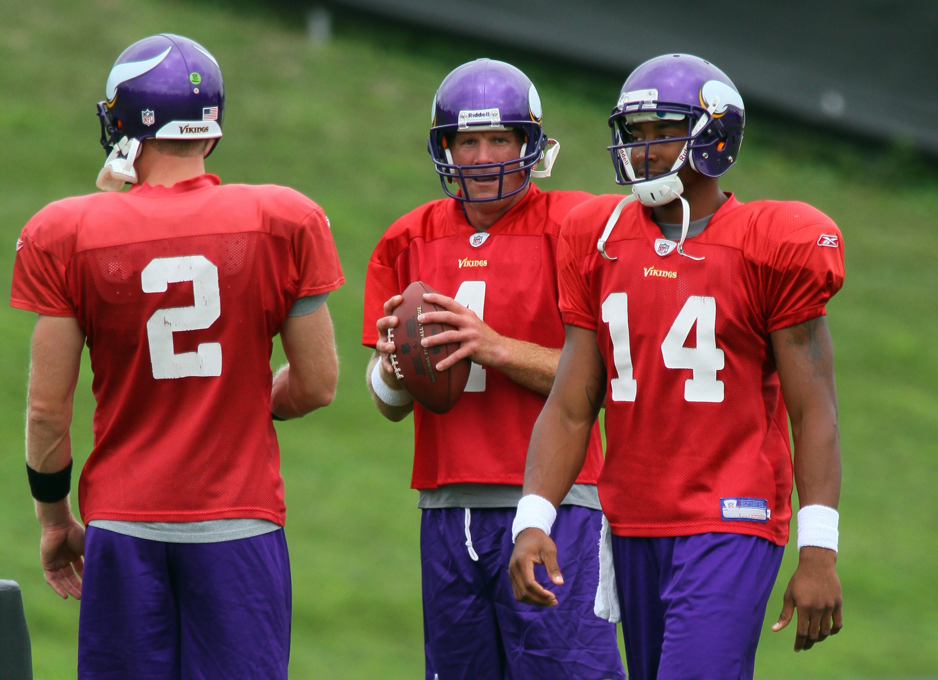 EDEN PRAIRIE, MN - AUGUST 18: Quarterbacks Sage Rosenfels #2, Brett Favre #4 and Joe Webb #14 of the Minnesota Vikings participate in Favre's first morning practice since returning to Vikings Winter Park on August 18, 2010 in Eden Prairie, Minnesota. Favr