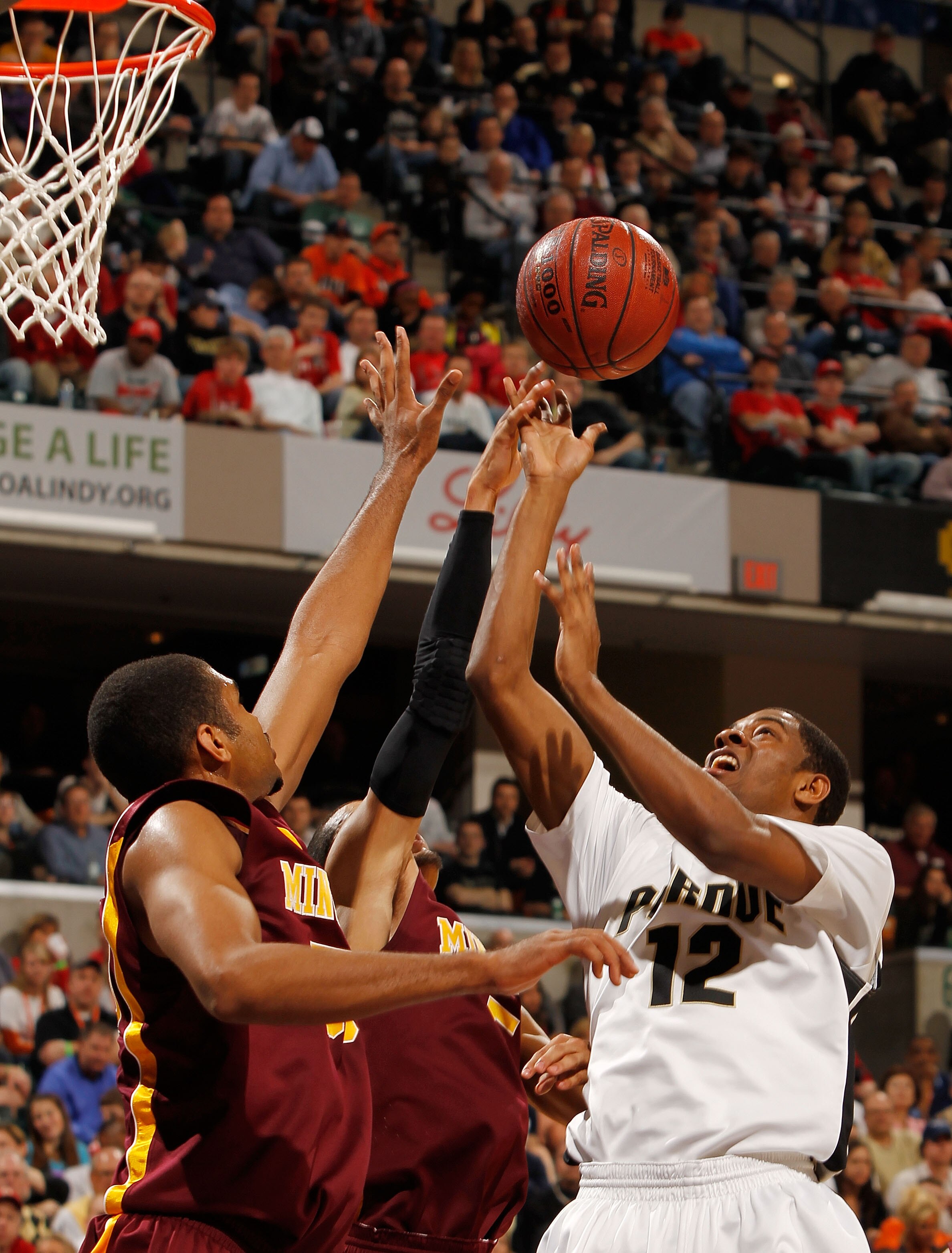 INDIANAPOLIS - MARCH 13:  Guard Kelsey Barlow #12 of the Purdue Boilermakers takes a shot against the Minnesota Golden Gophers in the semifinals of the Big Ten Men's Basketball Tournament at Conseco Fieldhouse on March 13, 2010 in Indianapolis, Indiana.