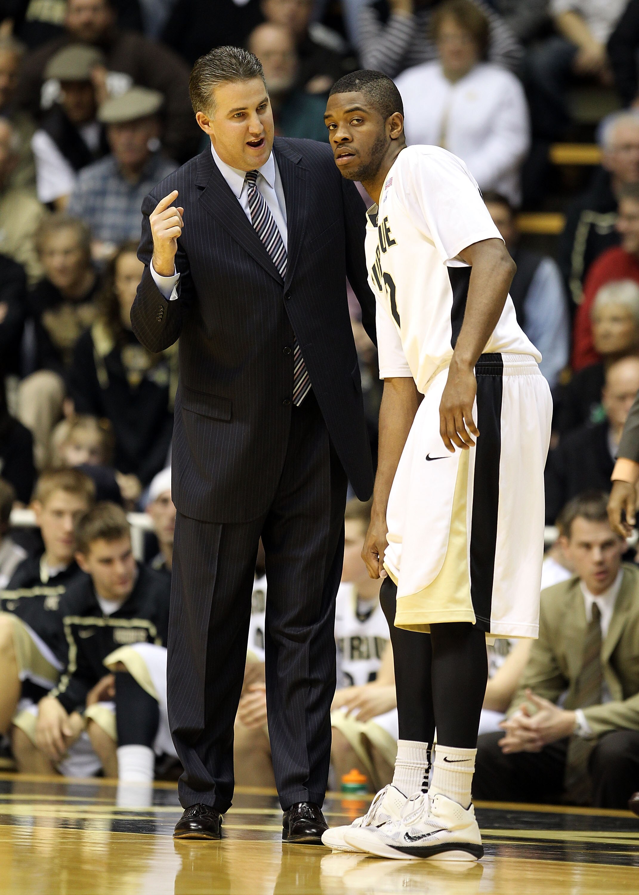 WEST LAFAYETTE, IN - DECEMBER 21:  Matt Painter the Head coach of the Purdue Boilermakers gives instructions to Kelsey Barlow #12 during the game against the IPFW Mastodons at Mackey Arena on December 21, 2010 in West Lafayette, Indiana.  (Photo by Andy L