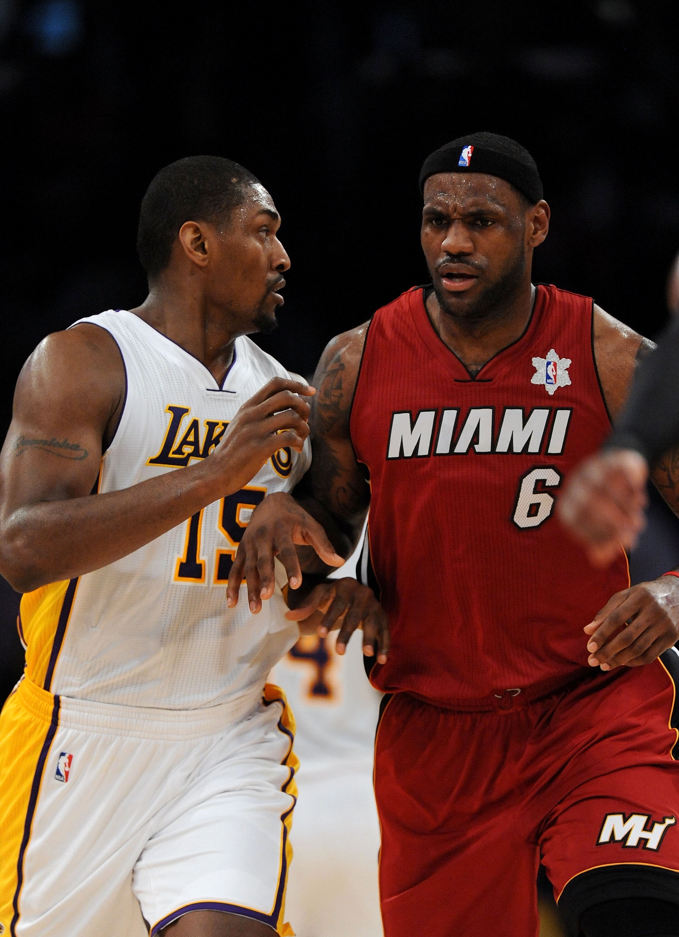 LOS ANGELES, CA - DECEMBER 25:  Ron Artest #15 of the Los Angeles Lakers and LeBron James #6 of the Miami Heat run upcourt during the game at Staples Center on December 25, 2010 in Los Angeles, California. NOTE TO USER: User expressly acknowledges and agr