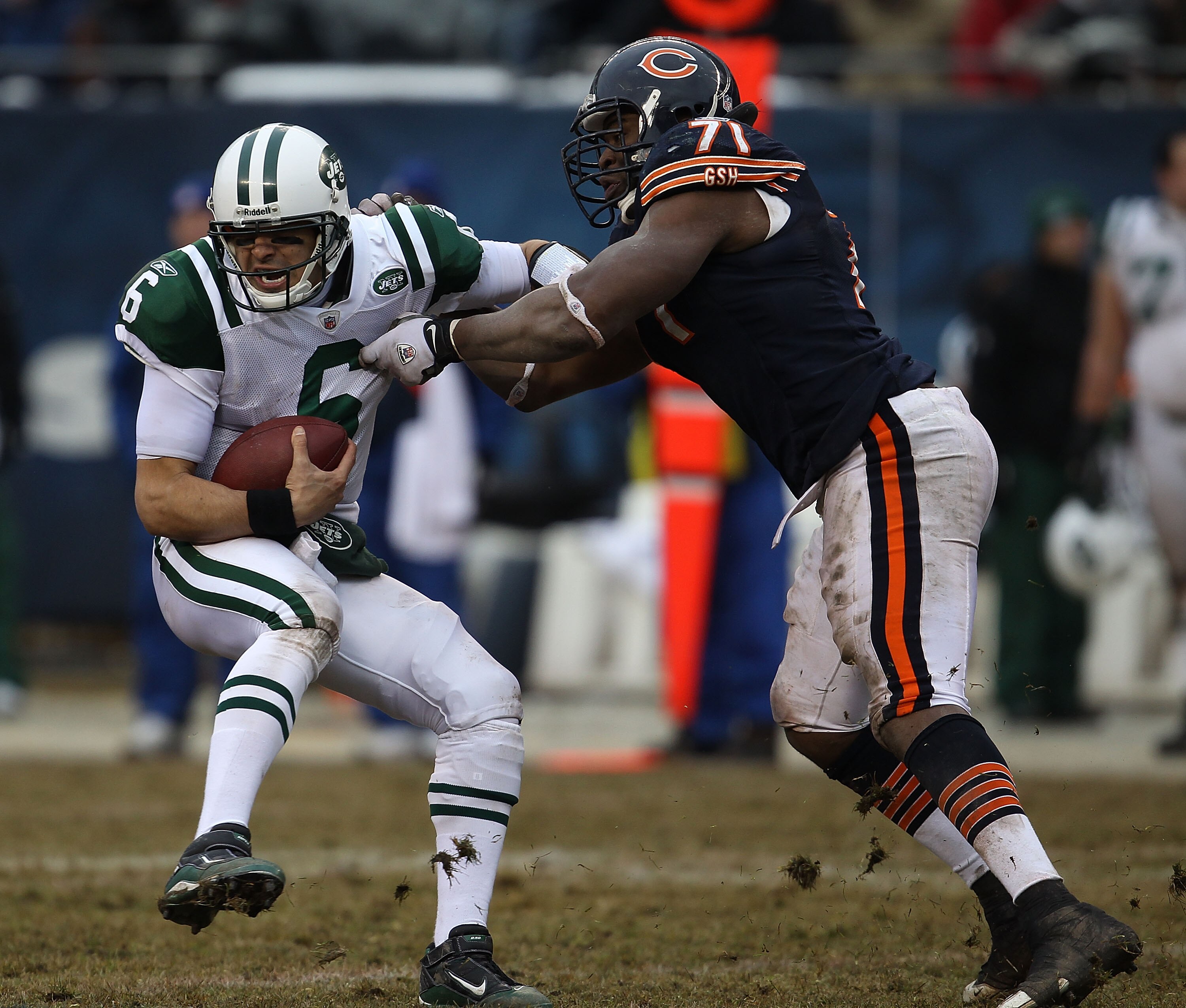 CHICAGO, IL - DECEMBER 26: Mark Sanchez #6 of the New York Jets tries to escape from Israel Idonije #71 of the Chicago Bears at Soldier Field on December 26, 2010 in Chicago, Illinois. The Bears defeated the Jets 38-34. (Photo by Jonathan Daniel/Getty Ima