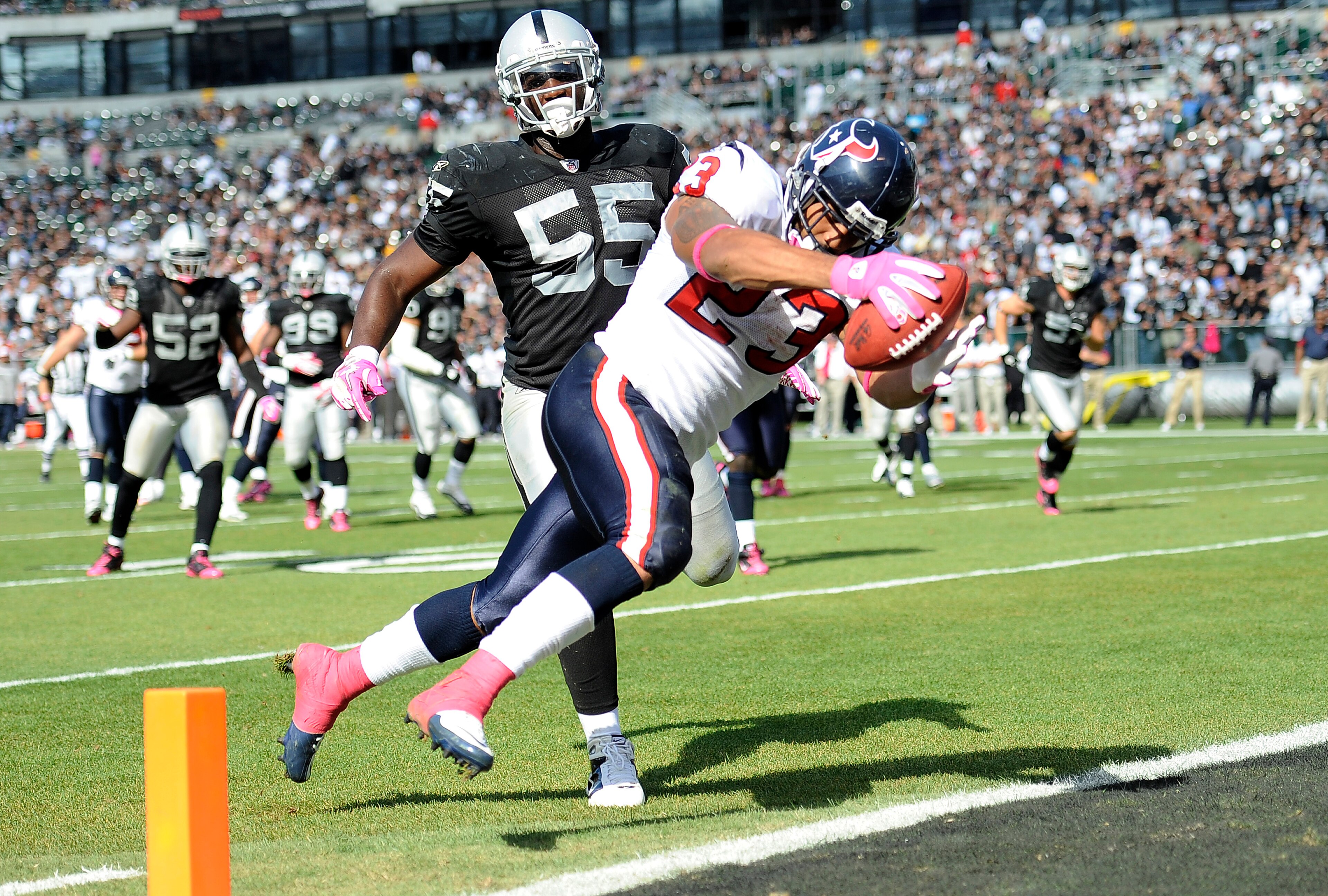 OAKLAND, CA - OCTOBER 3: Running back Arian Foster #23 of the Houston Texans scores a touchdown in front of linebacker Rolando McClain #55 of the Oakland Raiders during an NFL football game October 3, 2010 at The Oakland-Alameda County Coliseum in Oakla OAKLAND, CA - OCTOBER 3: Running back Arian Foster #23 of the Houston Texans scores a touchdown in front of linebacker Rolando McClain #55 of the Oakland Raiders during an NFL football game October 3, 2010 at The Oakland-Alameda County Coliseum in Oakla