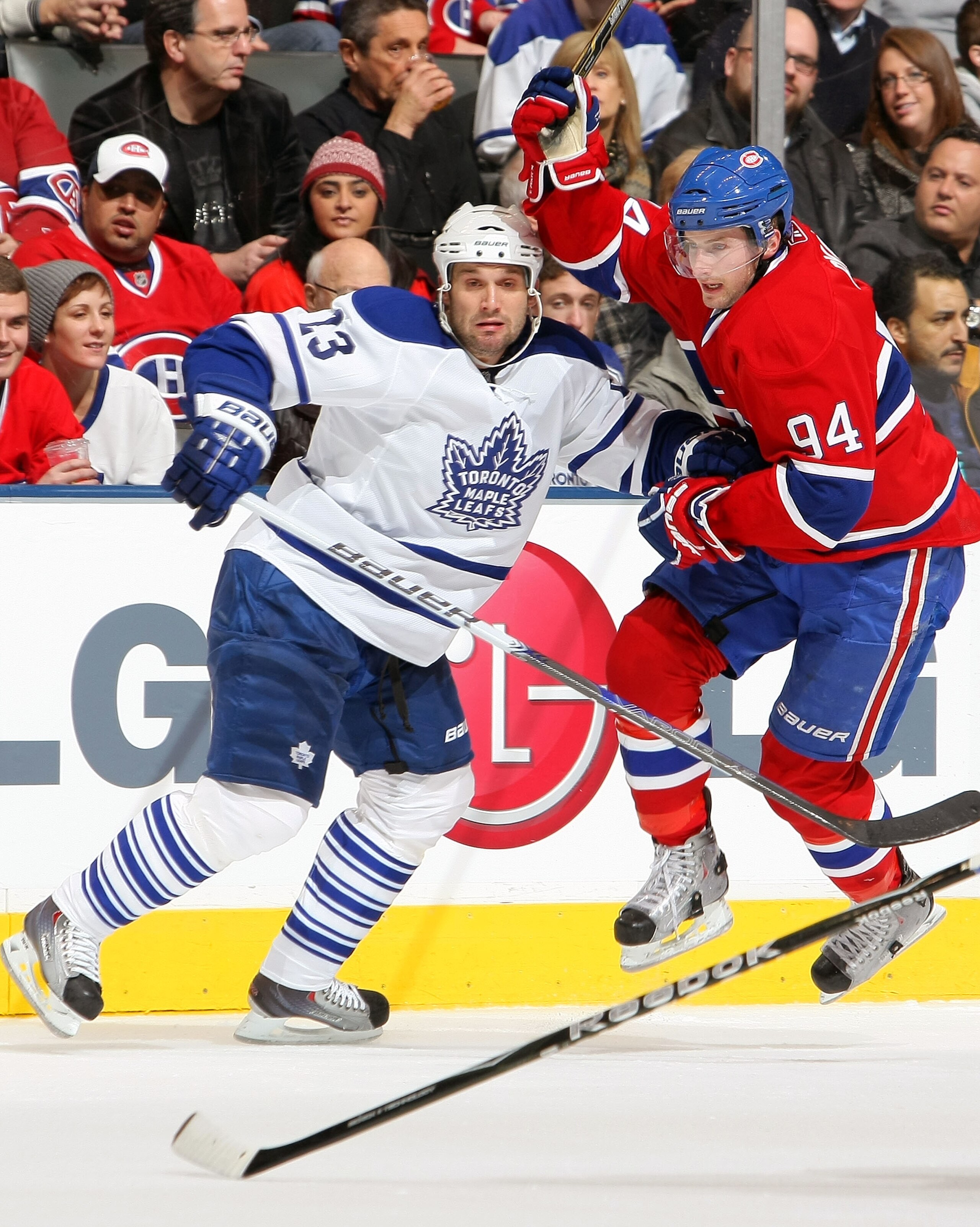 TORONTO - DECEMBER 11:  Brett Lebda #23 of the Toronto Maple Leafs defends against Tom Pyatt #94 of the Montreal Canadiens during their NHL game at Air Canada Centre on December 11, 2010 in Toronto, Ontario, Canada.  (Photo by Dave Sandford/Getty Images)