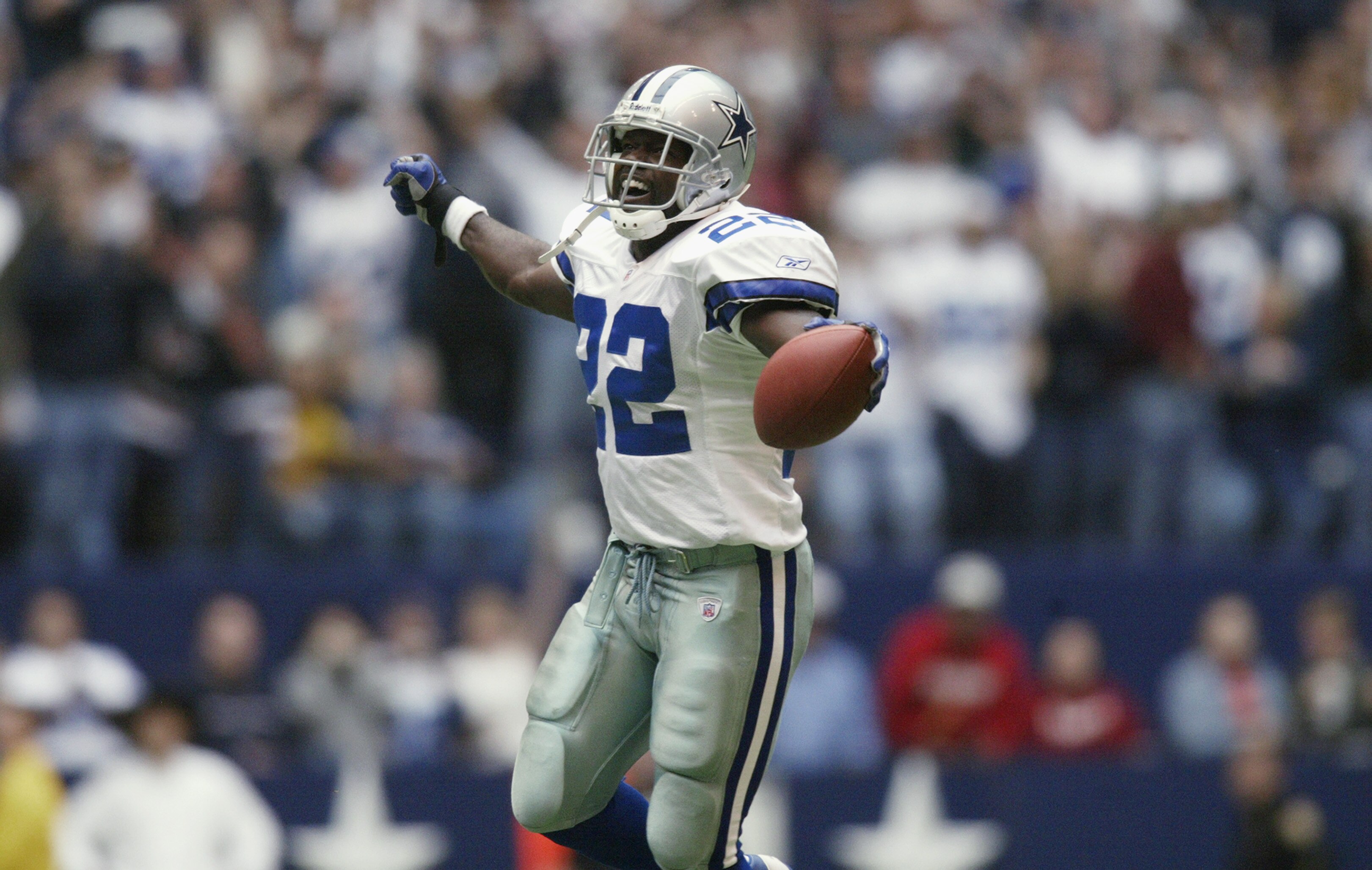 IRVING, TX - OCTOBER 27:   Running Back Emmitt Smith #22 of the Dallas Cowboys celebrates beating the NFL rushing record during the NFL game against the Seattle Seahawks at Texas Stadium on October 27, 2002 in Irving, Texas. The Seahawks defeated the Cowb