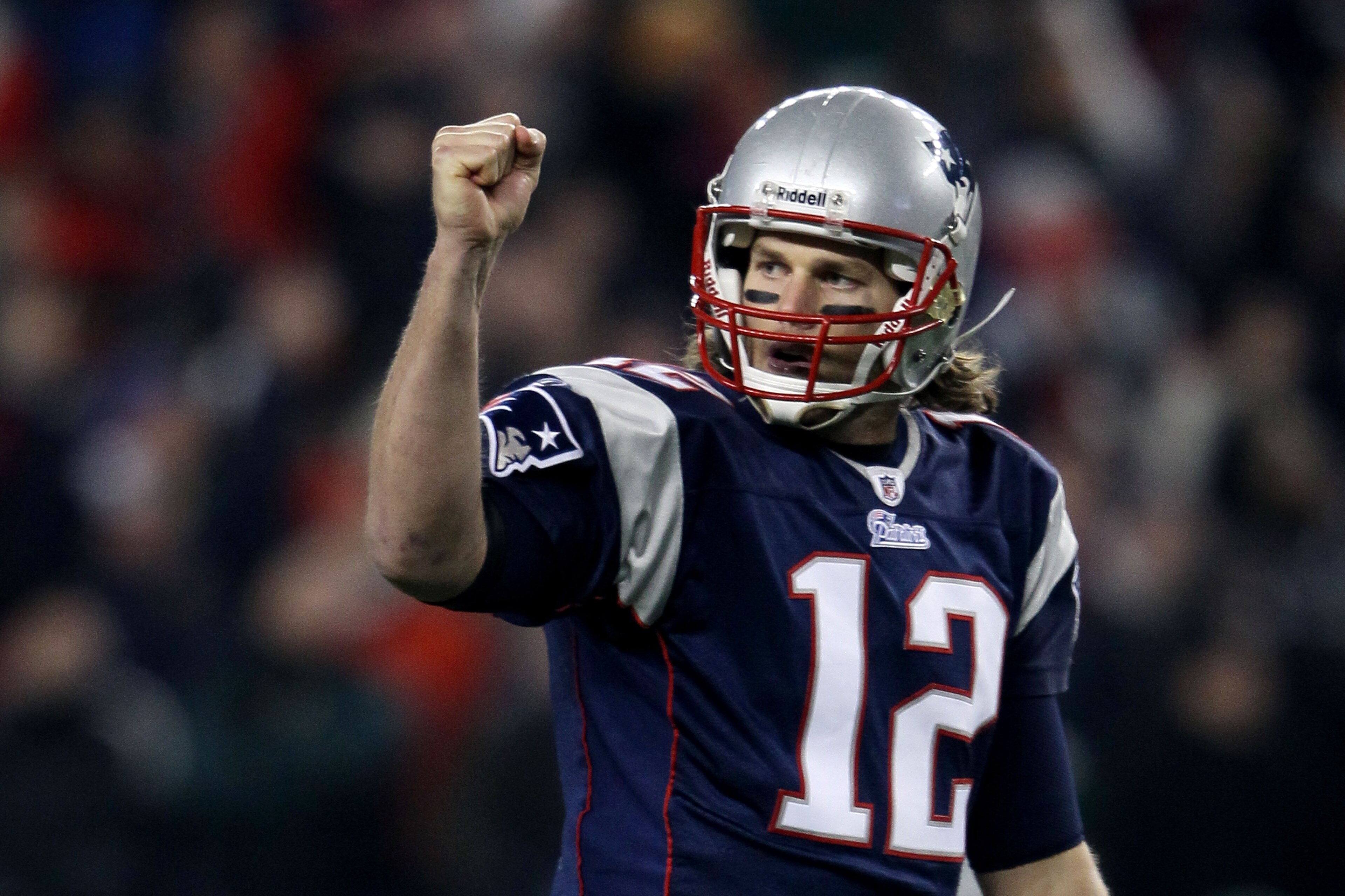 FOXBORO, MA - DECEMBER 19: Quarterback Tom Brady #12 of the New England Patriots celebrates a touchdown scored by running back BenJarvus Green-Ellis #42 (not pictured) against the Green Bay Packers in the first quarter of the game at Gillette Stadium on FOXBORO, MA - DECEMBER 19: Quarterback Tom Brady #12 of the New England Patriots celebrates a touchdown scored by running back BenJarvus Green-Ellis #42 (not pictured) against the Green Bay Packers in the first quarter of the game at Gillette Stadium on