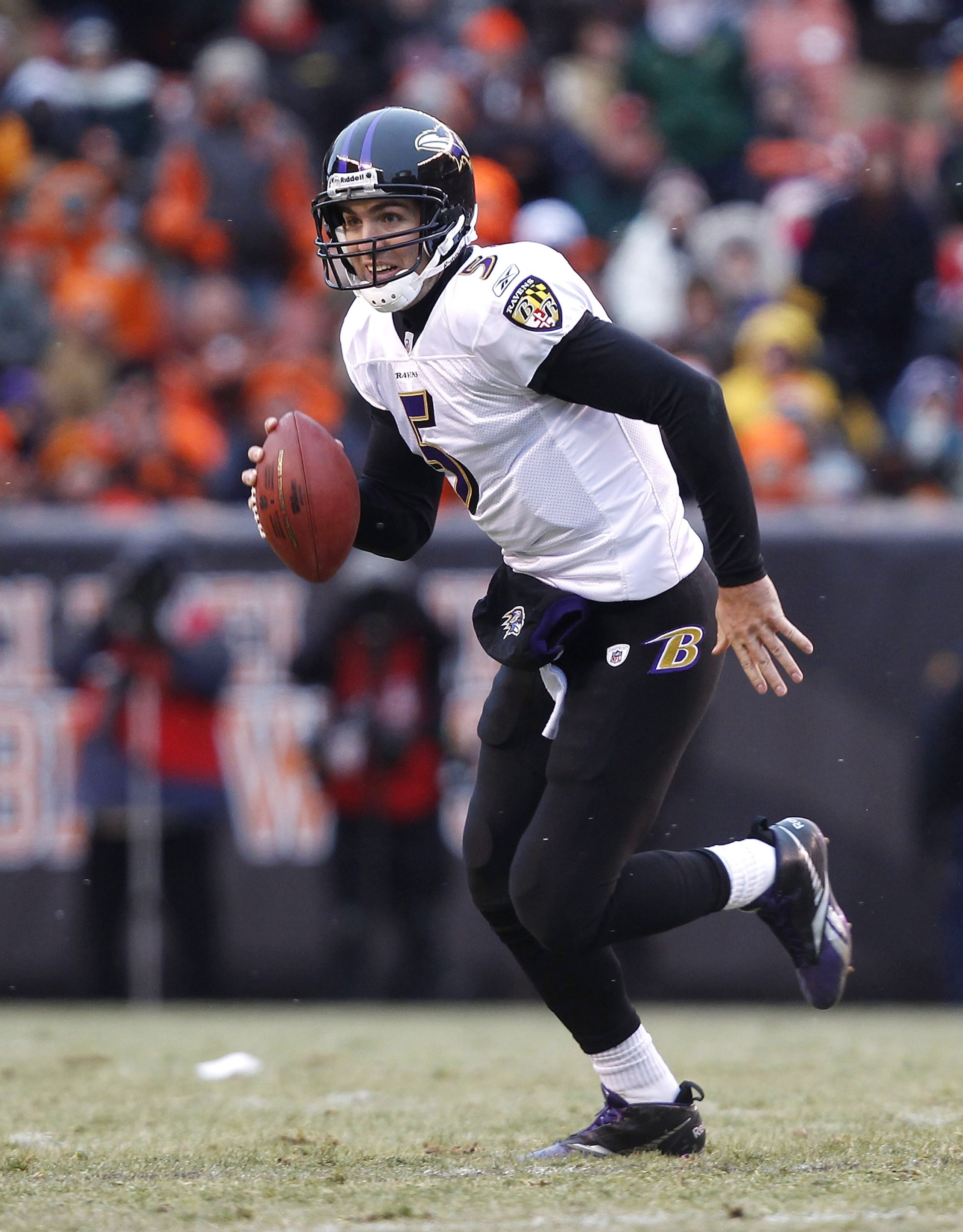 CLEVELAND - DECEMBER 26:  Quarterback Joe Flacco #5 of the Baltimore Ravens runs against the Cleveland Browns at Cleveland Browns Stadium on December 26, 2010 in Cleveland, Ohio.  (Photo by Matt Sullivan/Getty Images)