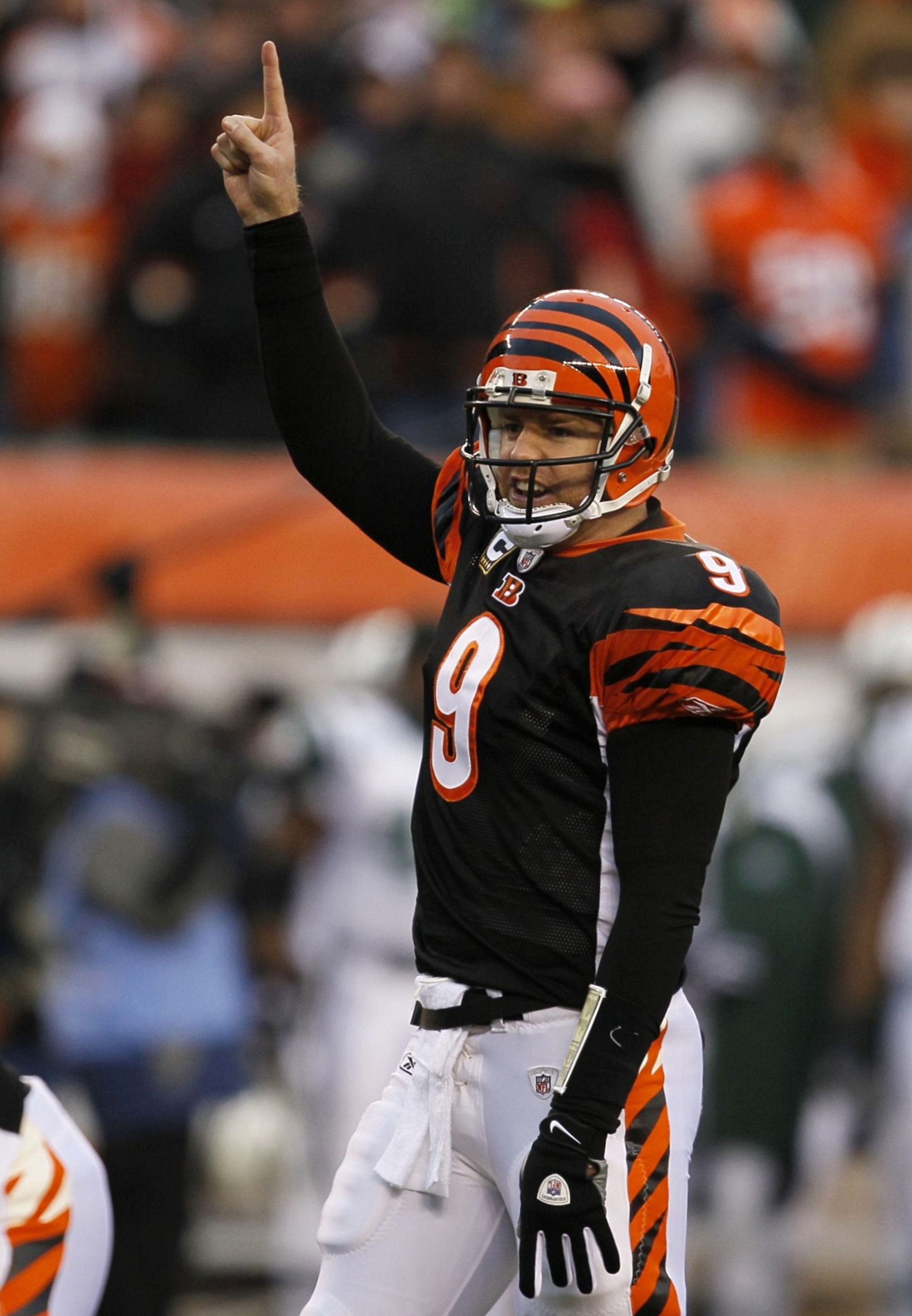 CINCINNATI - JANUARY 9:  Quarterback Carson Palmer #9 of the Cincinnati Bengals points up in the first quarter during the 2010 AFC wild-card playoff game against the New York Jets at Paul Brown Stadium on January 9, 2010 in Cincinnati, Ohio. (Photo by Jon