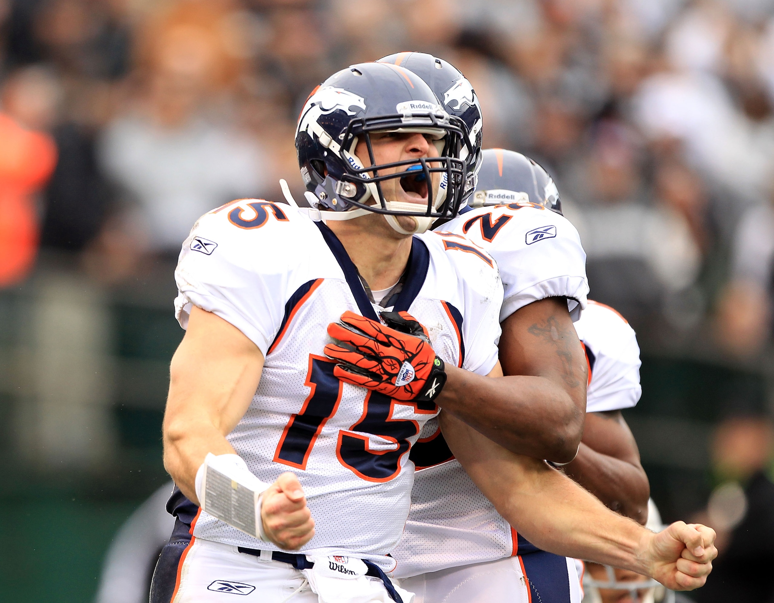 OAKLAND, CA - DECEMBER 19:  Tim Tebow #15 of the Denver Broncos celebrates after he ran in for a touchdown against the Oakland Raiders at Oakland-Alameda County Coliseum on December 19, 2010 in Oakland, California.  (Photo by Ezra Shaw/Getty Images)