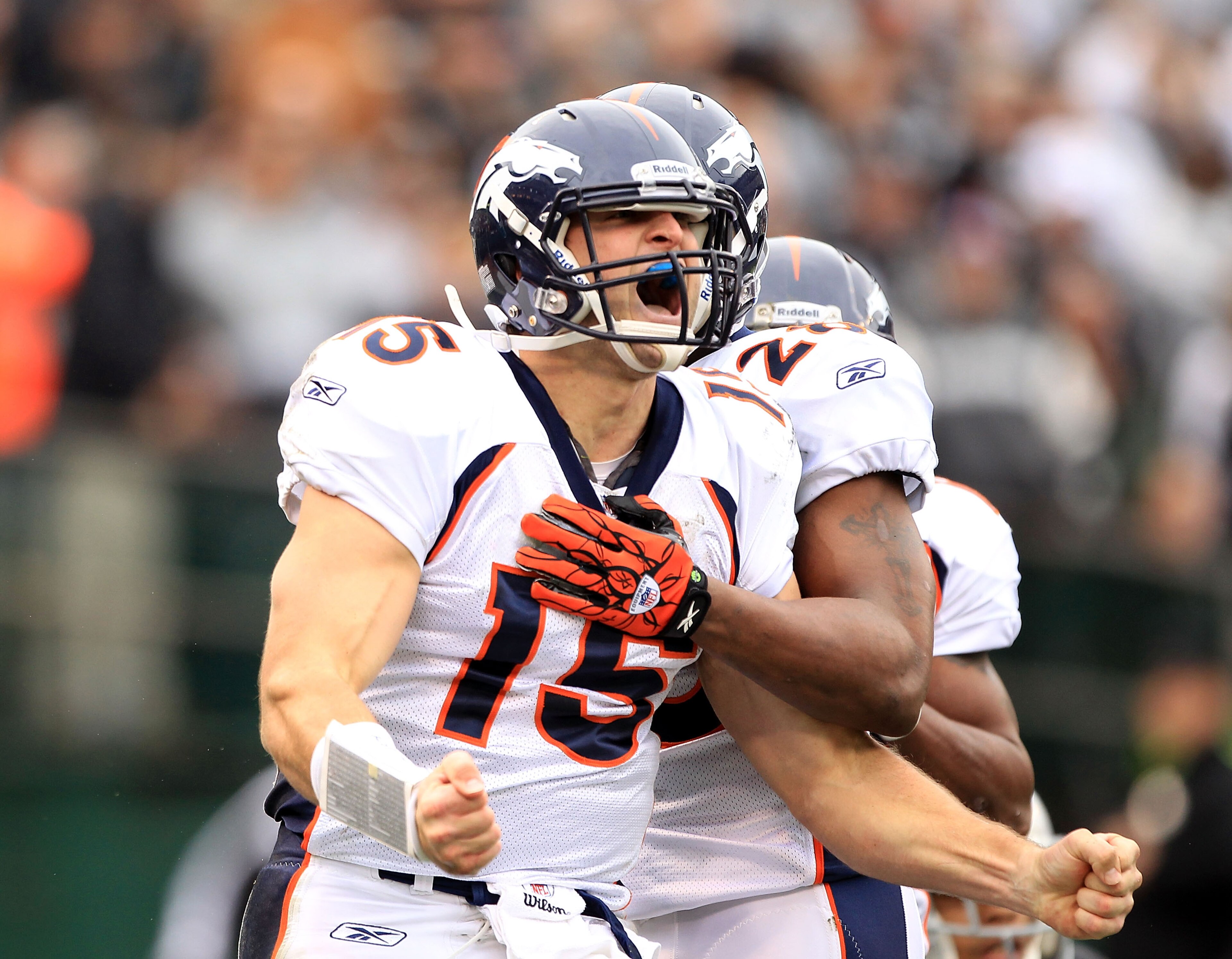 OAKLAND, CA - DECEMBER 19:  Tim Tebow #15 of the Denver Broncos celebrates after he ran in for a touchdown against the Oakland Raiders at Oakland-Alameda County Coliseum on December 19, 2010 in Oakland, California.  (Photo by Ezra Shaw/Getty Images)
