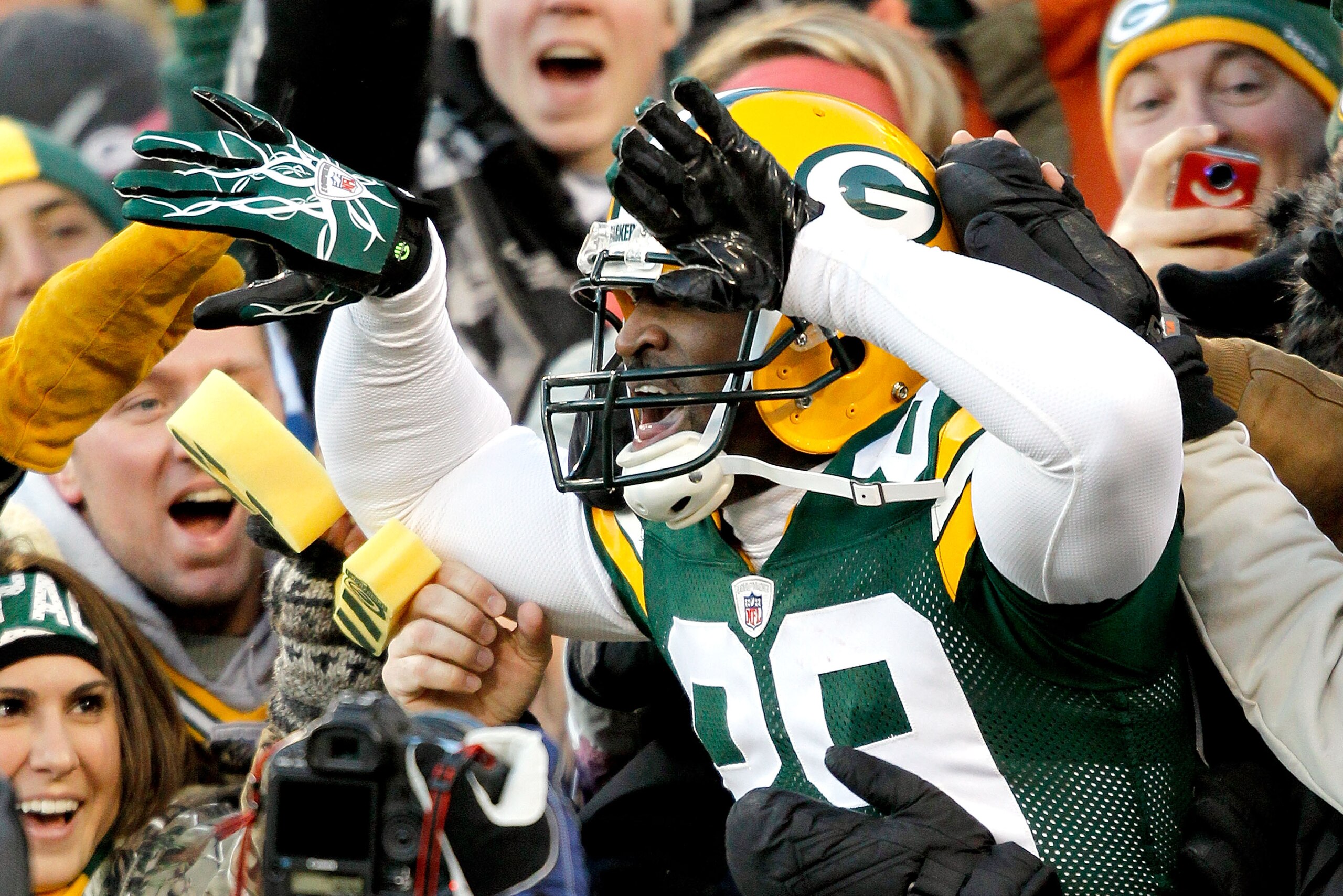 GREEN BAY, WI - DECEMBER 26: James Jones #89 of the Green Bay Packers leaps into the stands after scoring a touchdown against the New York Giants at Lambeau Field on December 26, 2010 in Green Bay, Wisconsin. (Photo by Matthew Stockman/Getty Images) GREEN BAY, WI - DECEMBER 26: James Jones #89 of the Green Bay Packers leaps into the stands after scoring a touchdown against the New York Giants at Lambeau Field on December 26, 2010 in Green Bay, Wisconsin. (Photo by Matthew Stockman/Getty Images)