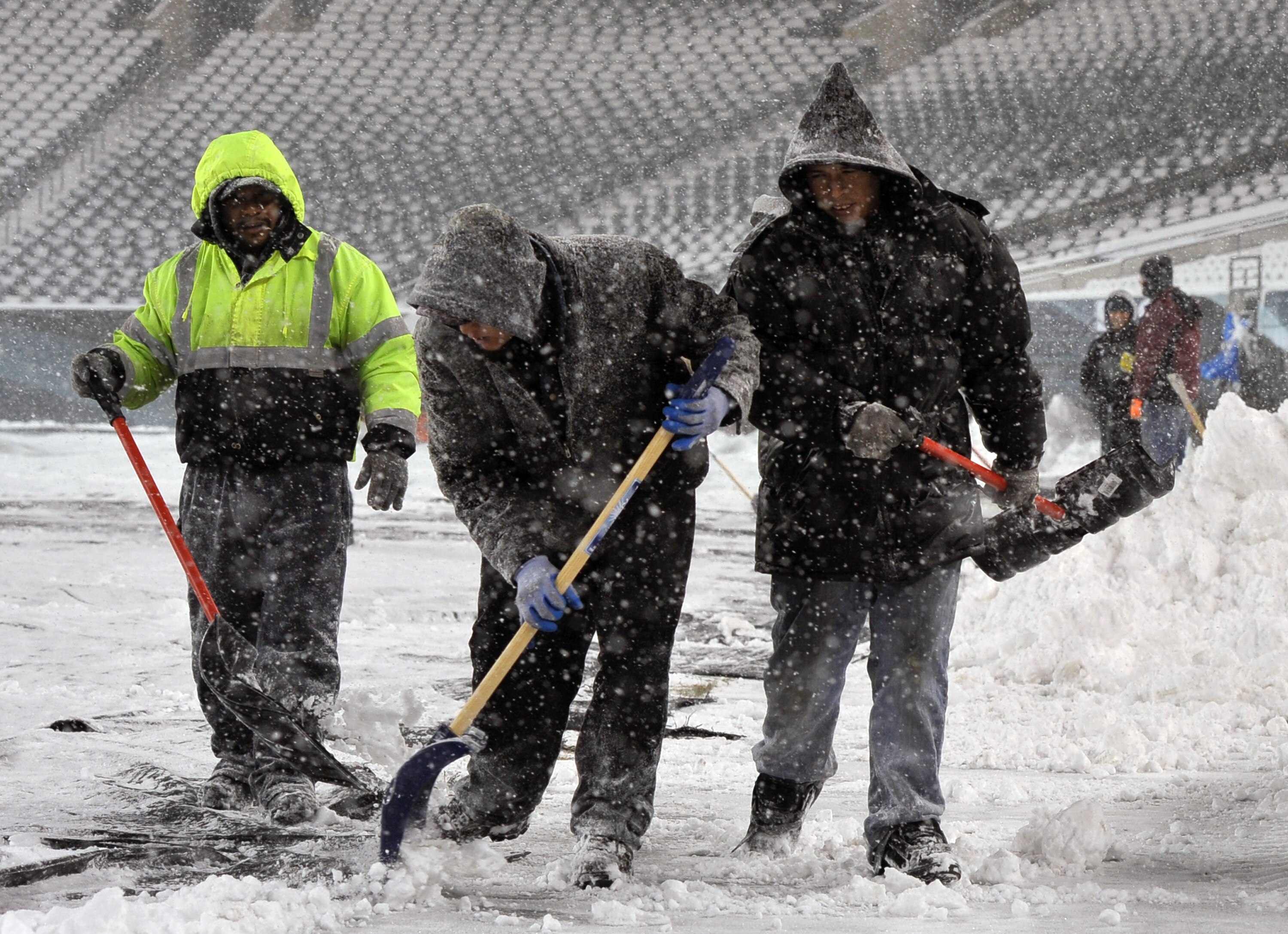 PHILADELPHIA - DECEMBER 26: Personnel work to remove snow at Lincoln Financial Field on December 26, 2010 in Philadelphia, Pennsylvania. The game between the Minnesota Vikings and Philadelphia Eagles was postponed by the NFL.(Photo by Drew Hallowell/Getty