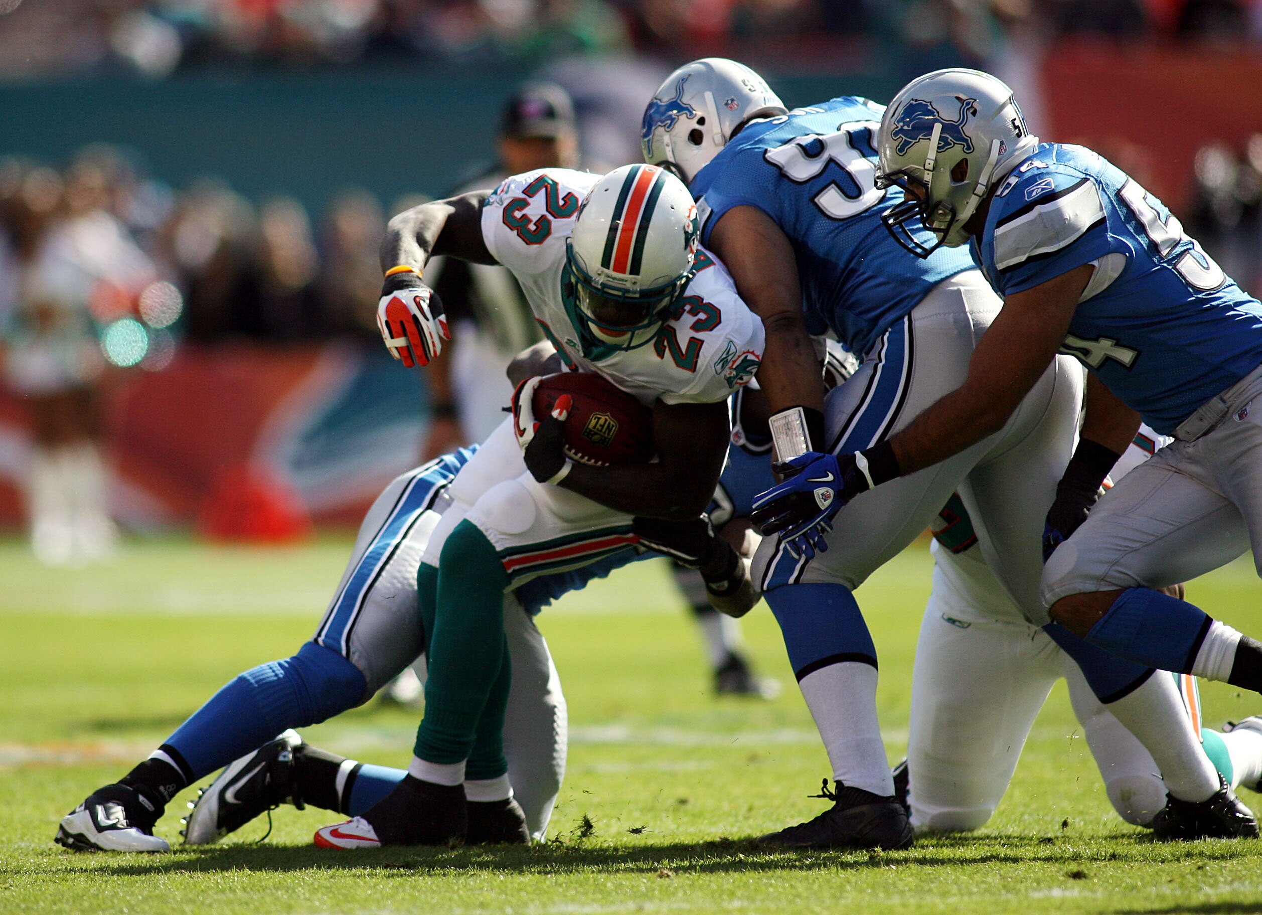 MIAMI - DECEMBER 26: Running back Ronnie brown #23 of the Miami Dolphins is stopped by the Detroit Lions at Sun Life Stadium on December 26, 2010 in Miami, Florida. The Lions defeated the Dolphins 34-27. (Photo by Marc Serota/Getty Images) MIAMI - DECEMBER 26: Running back Ronnie brown #23 of the Miami Dolphins is stopped by the Detroit Lions at Sun Life Stadium on December 26, 2010 in Miami, Florida. The Lions defeated the Dolphins 34-27. (Photo by Marc Serota/Getty Images)