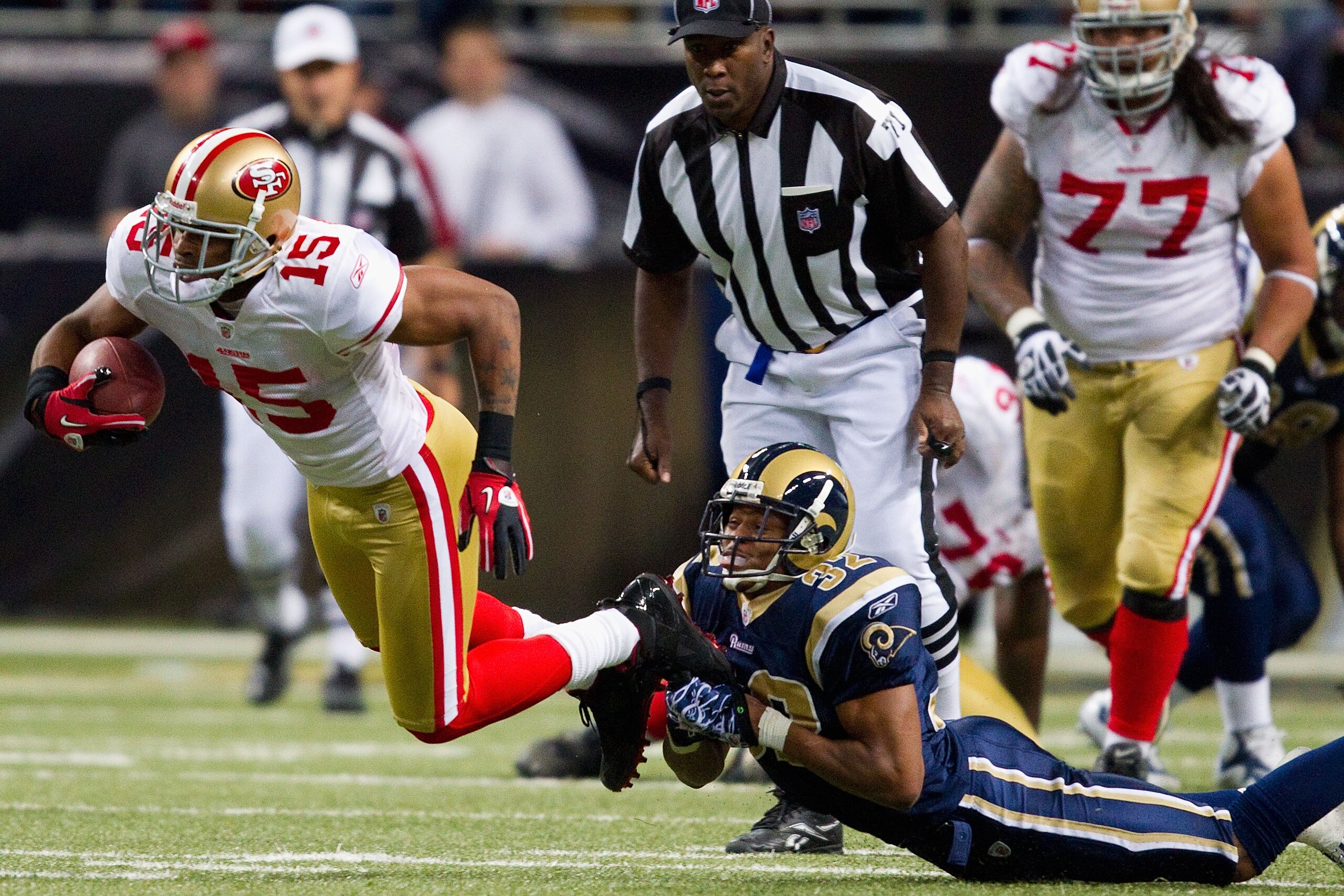 ST. LOUIS, MO - DECEMBER 26: Bradley Fletcher #32 of the St. Louis Rams tackles Michael Crabtree #15 of the San Francisco 49ers at the Edward Jones Dome on December 26, 2010 in St. Louis, Missouri. The Rams beat the 49ers 25-17. (Photo by Dilip Vishwanat/
