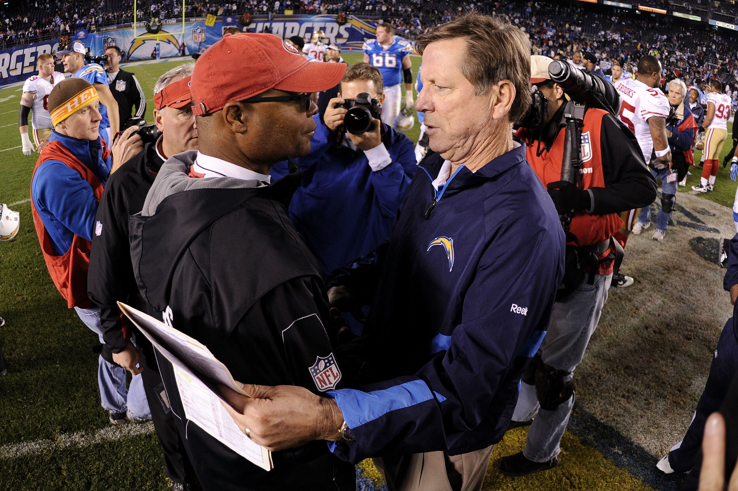 SAN DIEGO, CA - DECEMBER 16: (R-L) Head coach Norv Turner of the San Diego Chargers speaks with head coach Mike Singletary of the San Francisco 49ers following the Chargers 34-7 win at Qualcomm Stadium on December 16, 2010 in San Diego, California. (Phot SAN DIEGO, CA - DECEMBER 16: (R-L) Head coach Norv Turner of the San Diego Chargers speaks with head coach Mike Singletary of the San Francisco 49ers following the Chargers 34-7 win at Qualcomm Stadium on December 16, 2010 in San Diego, California. (Phot