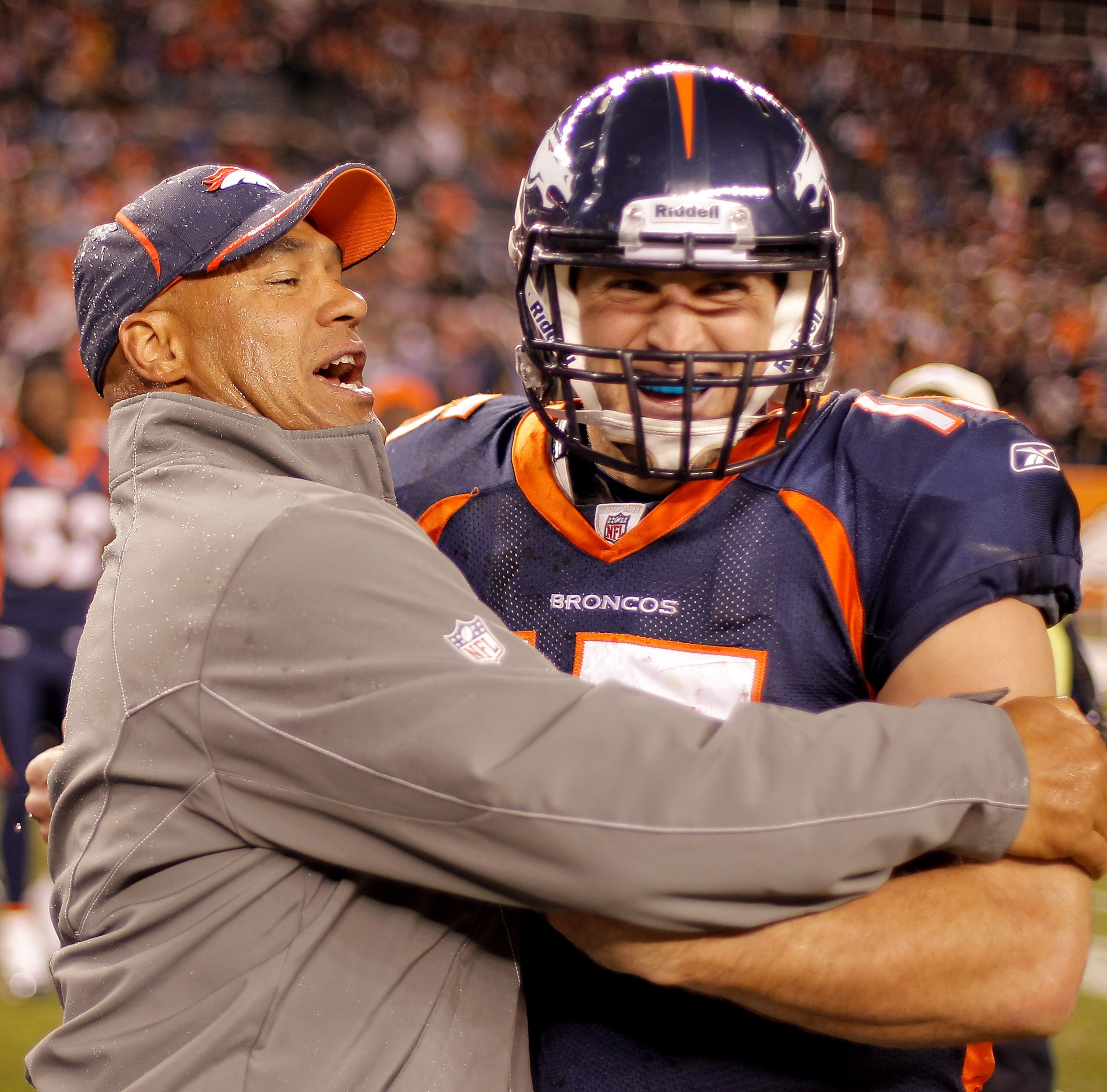 DENVER - DECEMBER 26:  Head coach Eric Studesville of the Denver Broncos celebrates with quarterback Tim Tebow #15 following the Broncos 24-23 victory over the Houston Texans at INVESCO Field at Mile High on December 26, 2010 in Denver, Colorado. (Photo b
