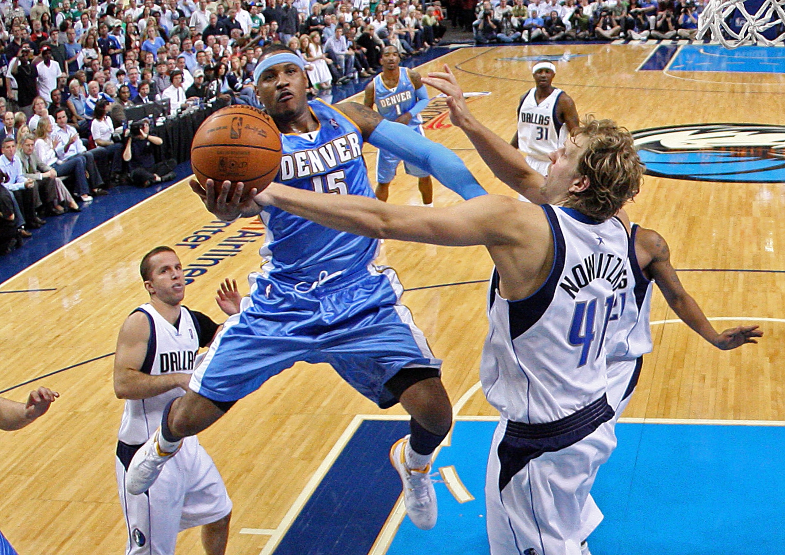 DALLAS - MAY 11:  Forward Carmelo Anthony #15 of the Denver Nuggets takes a shot against Dirk Nowtizki #41 of the Dallas Mavericks in Game Four of the Western Conference Semifinals during the 2009 NBA Playoffs at American Airlines Center on May 11, 2009 i