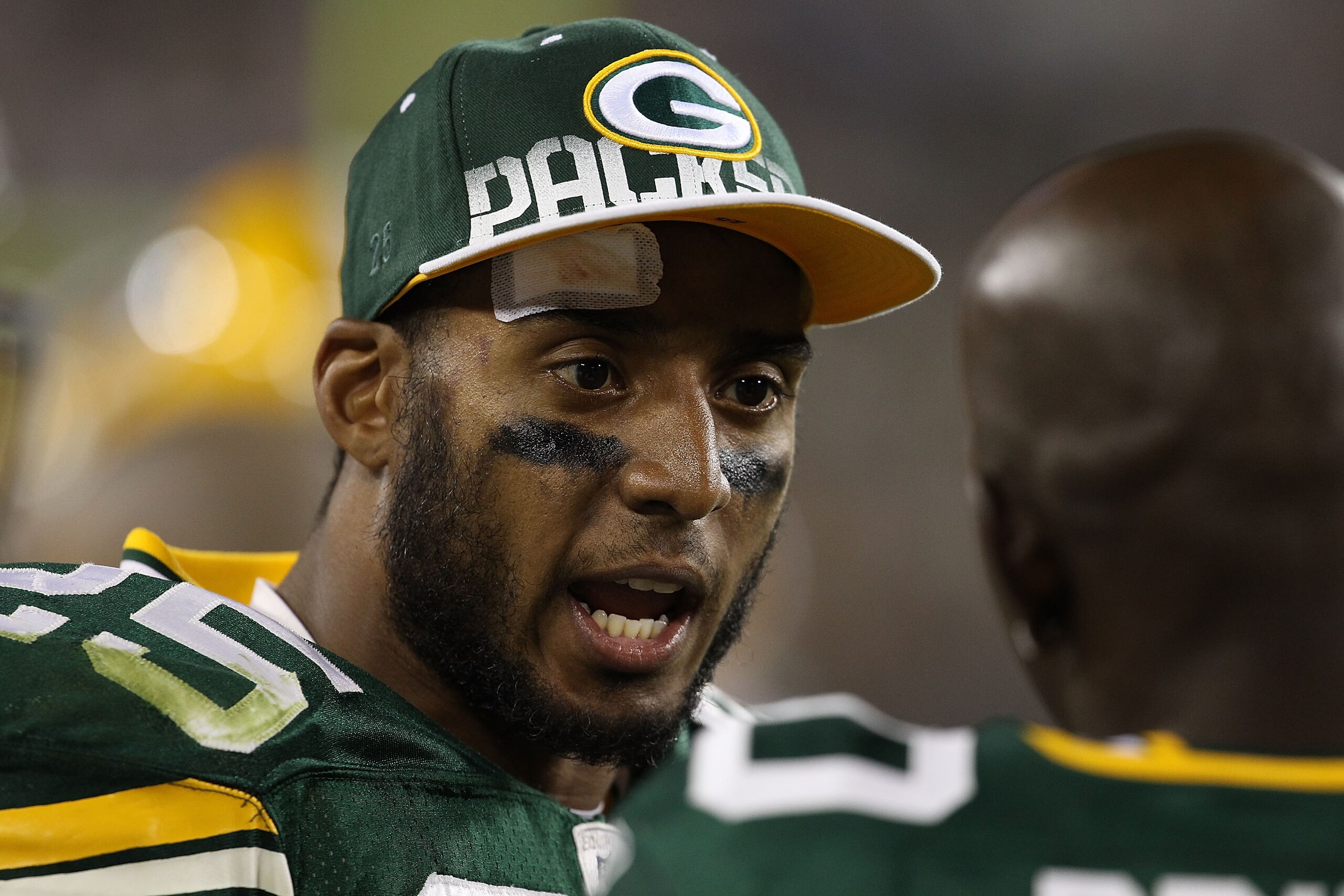 GREEN BAY, WI - AUGUST 26: Ryan Grant #25 of the Green Bay Packers talks with teammate Donald Driver #80 on the sidelines during a preseason game against the Indianapolis Colts at Lambeau Field on August 26, 2010 in Green Bay, Wisconsin. The Packers defea