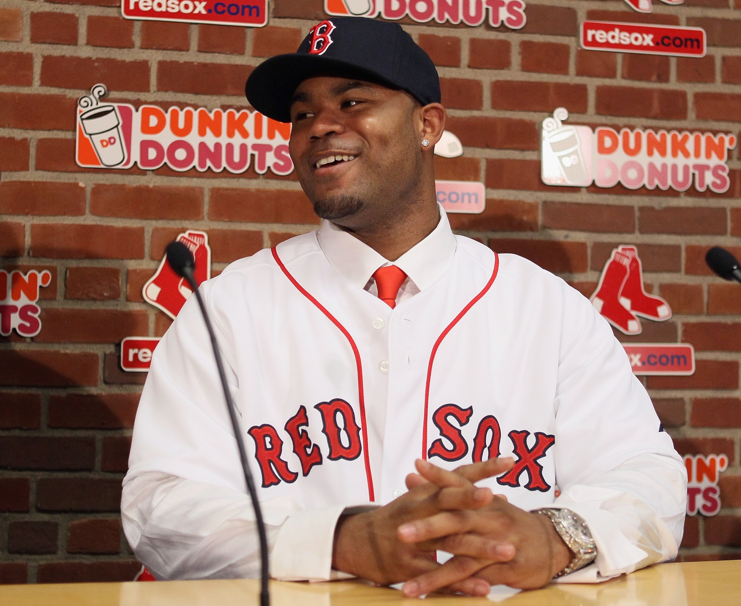 BOSTON, MA - DECEMBER 11:  Carl Crawford answers questions during a press conference to announce his joining the Boston Red Sox on December 11,  2010 at the Fenway Park in Boston, Massachusetts.  (Photo by Elsa/Getty Images)