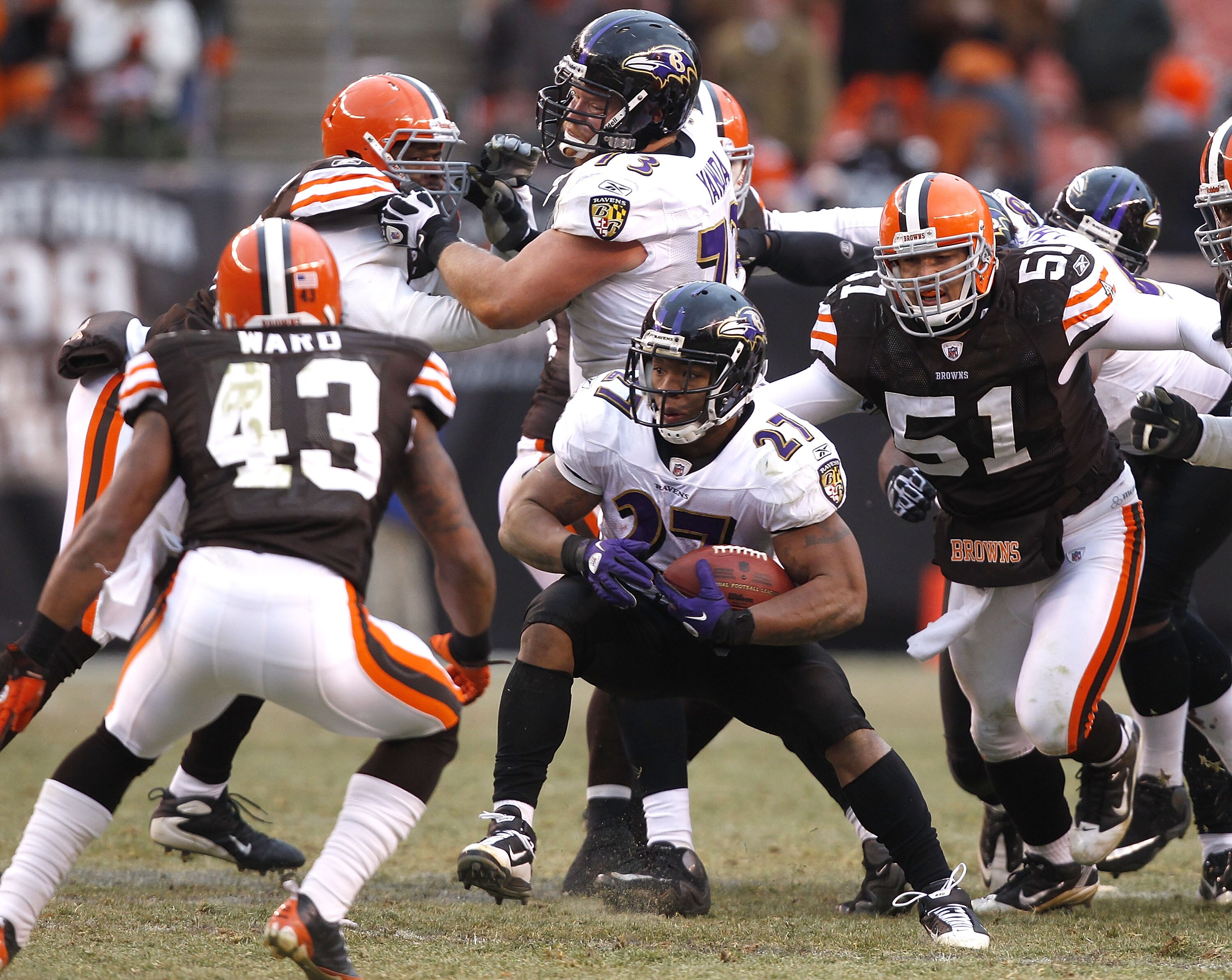 CLEVELAND - DECEMBER 26:  Running back Ray Rice #27 of the Baltimore Ravens runs by defenders T.J. Ward #43 and Chris Gocong #51 of the Cleveland Browns at Cleveland Browns Stadium on December 26, 2010 in Cleveland, Ohio.  (Photo by Matt Sullivan/Getty Im