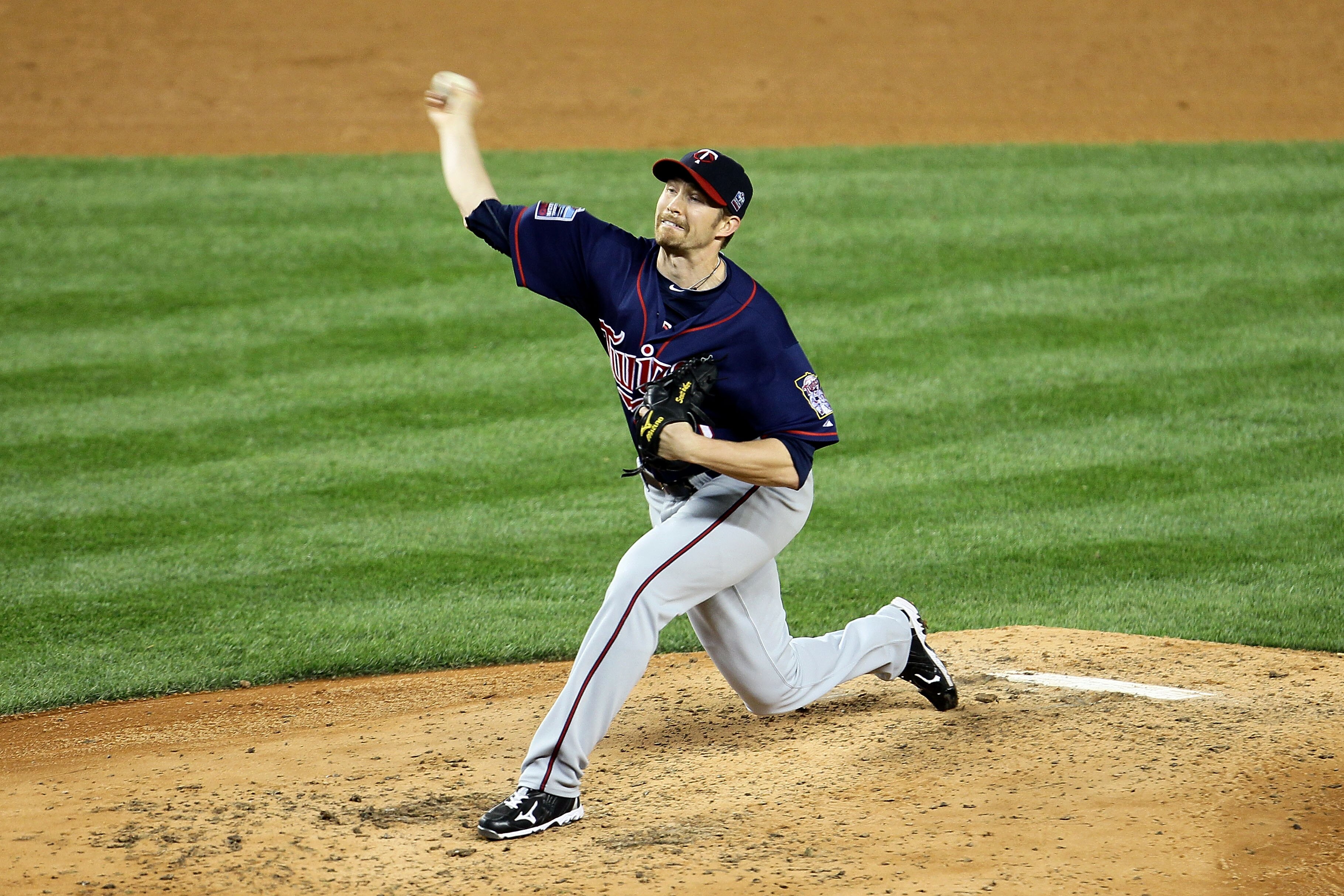 NEW YORK - OCTOBER 09:  Scott Baker #30 of the Minnesota Twins throws a pitch against the New York Yankees during Game Three of the ALDS part of the 2010 MLB Playoffs at Yankee Stadium on October 9, 2010 in the Bronx borough of New York City.  (Photo by C