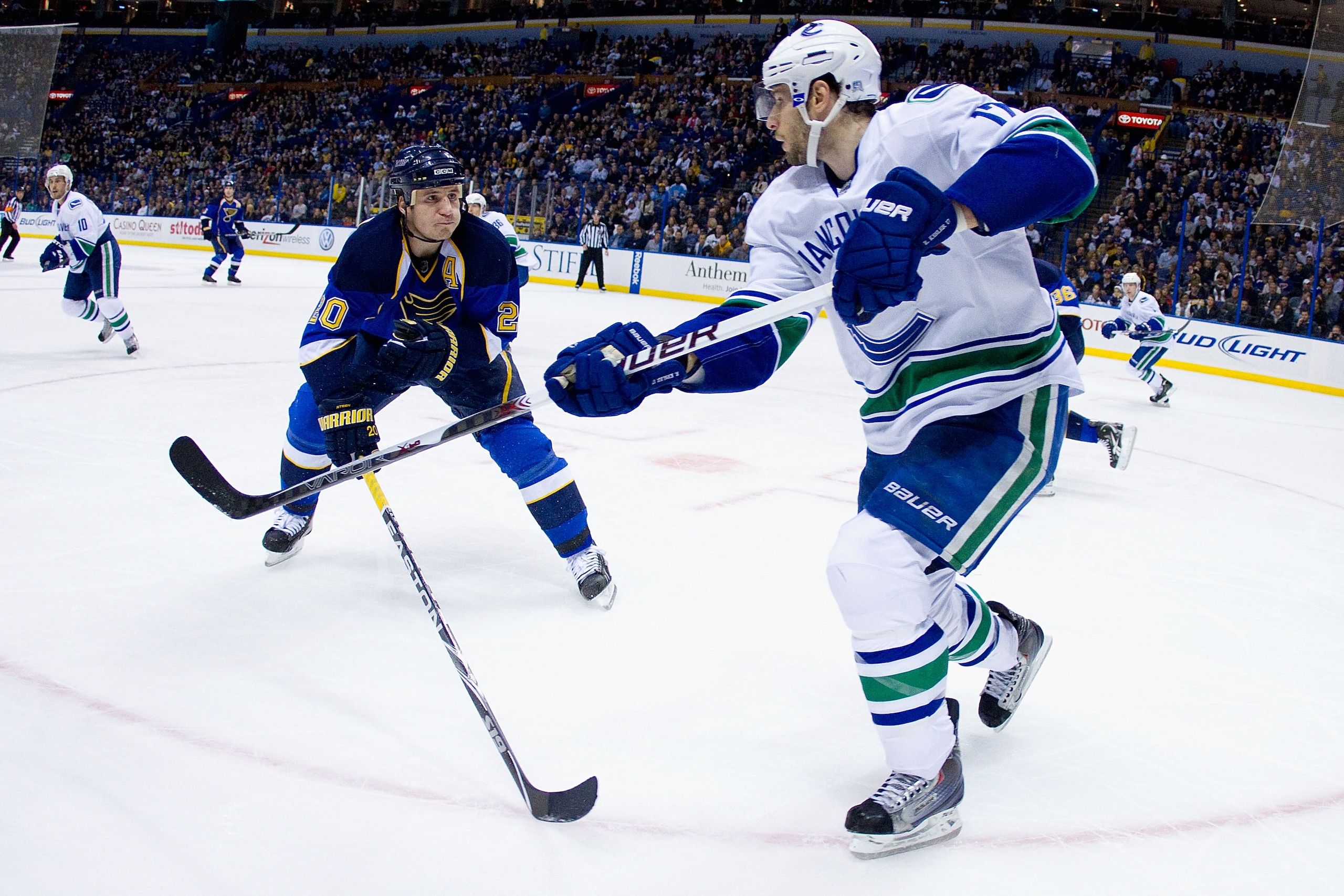 ST. LOUIS, MO - DECEMBER 20: Ryan Kesler #17 of the Vancouver Canucks clears the puck against Alexander Steen #20 of the St. Louis Blues at the Scottrade Center on December 20, 2010 in St. Louis, Missouri.  The Canucks beat the Blues 3-1.  (Photo by Dilip