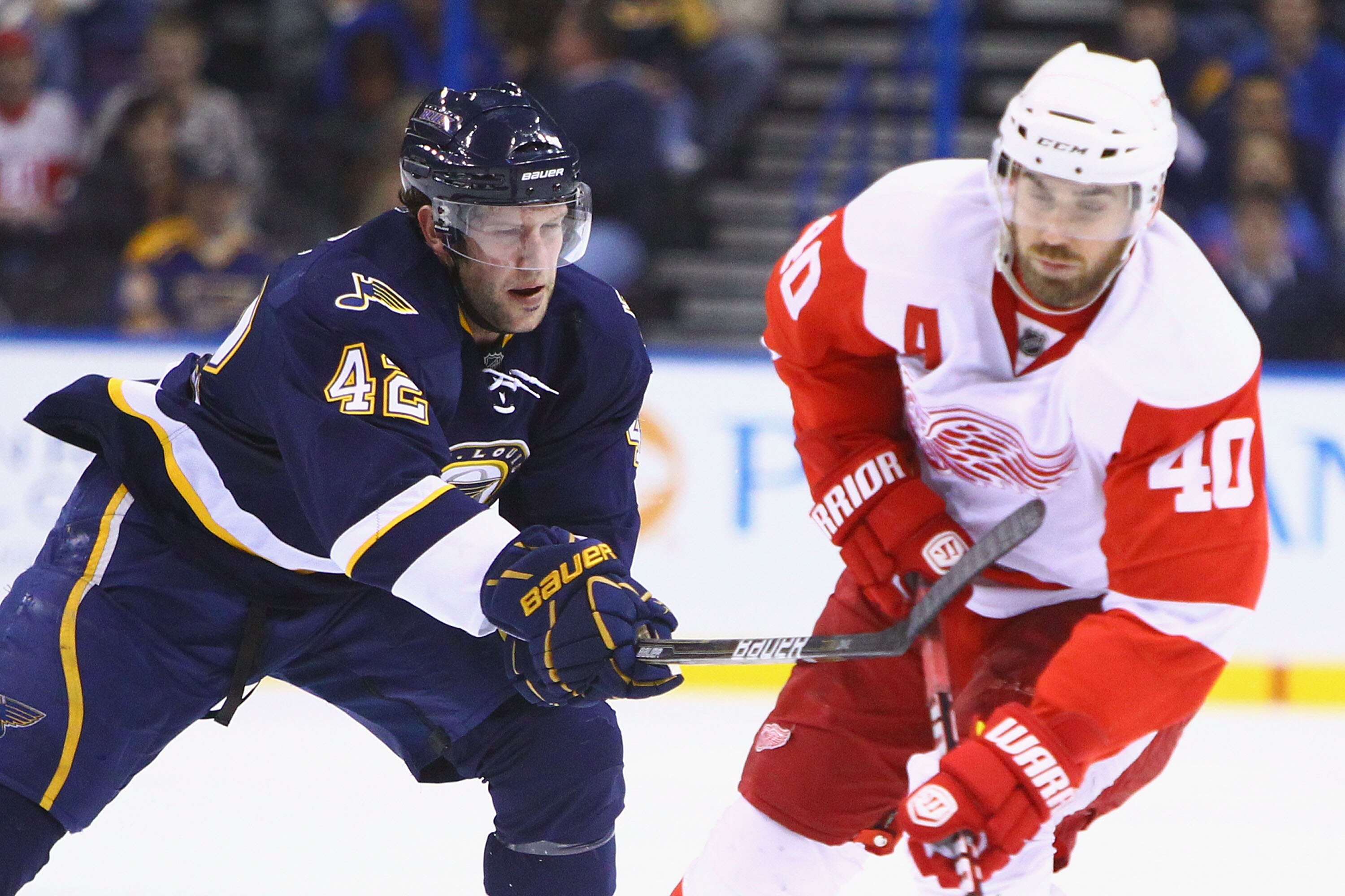 ST. LOUIS, MO - DECEMBER 23: David Backes #42 of the St. Louis Blues defends against Henrik Zetterberg #40 of the Detroit Red Wings at the Scottrade Center on December 23, 2010 in St. Louis, Missouri.  (Photo by Dilip Vishwanat/Getty Images)