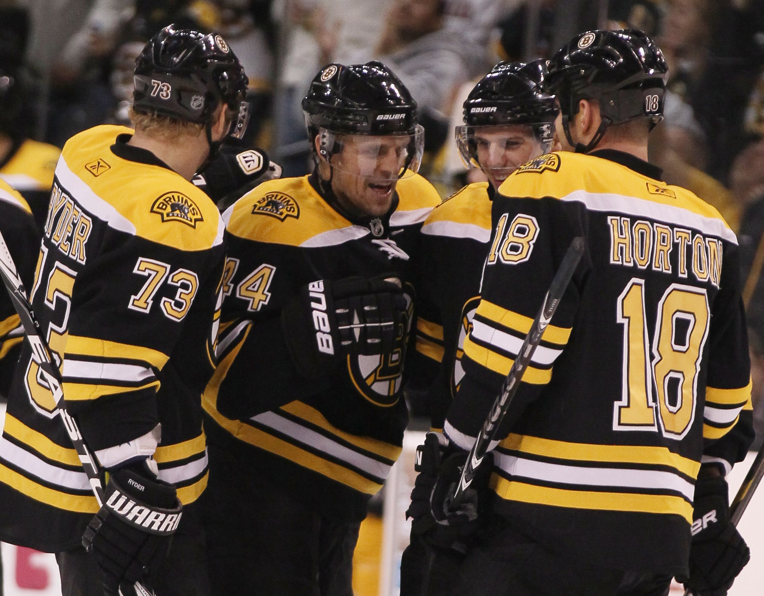 BOSTON, MA - DECEMBER 02:  Dennis Seidenberg #44 of the Boston Bruins is congratulated by teammates Michael Ryder #73 and Nathan Hornton #18 after Seidenberg scored a goal in the first period against the Tampa Bay Lightning on December 2, 2010 at the TD G