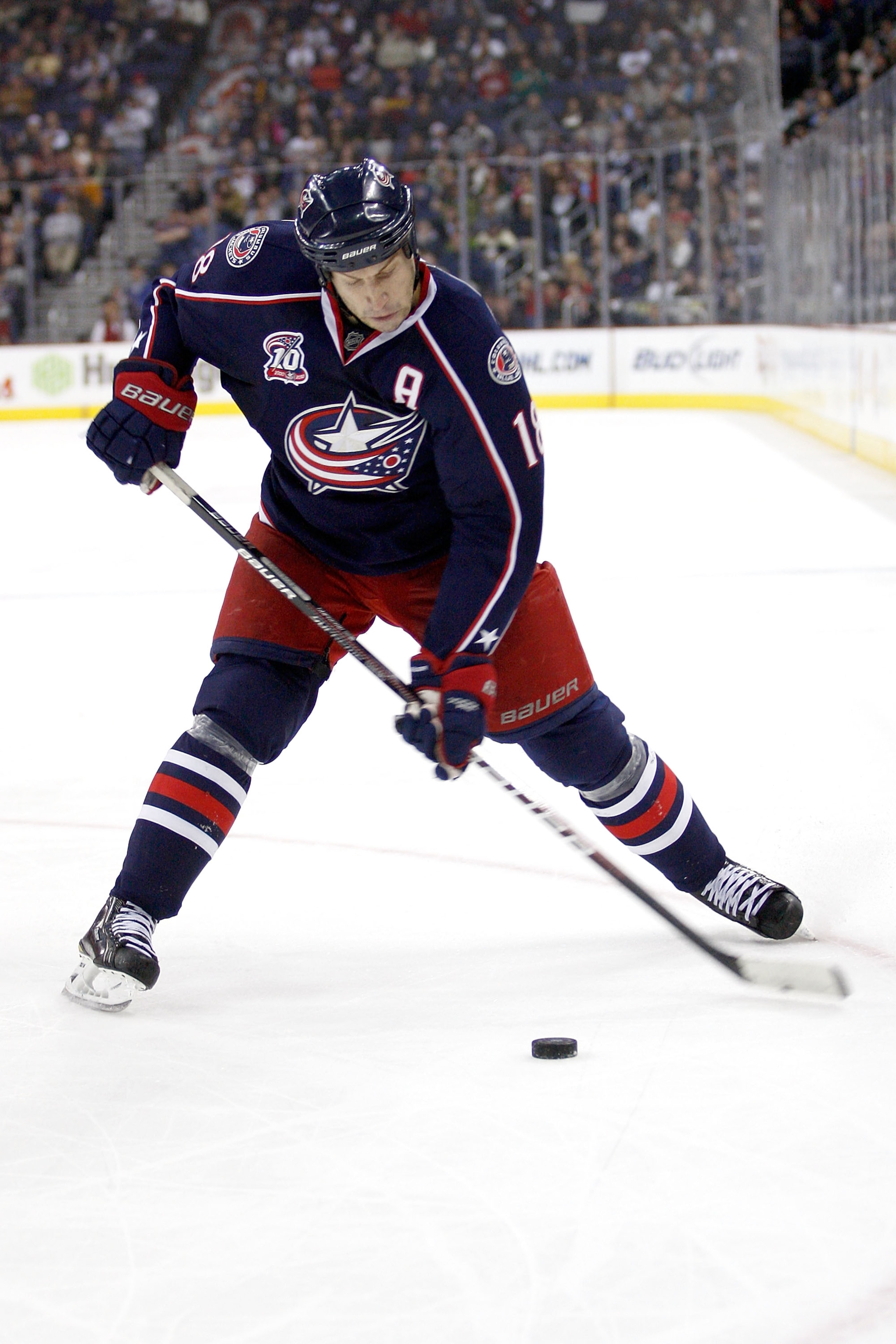COLUMBUS, OH - DECEMBER 21:  R.J. Umberger #18 of the Columbus Blue Jackets shoots the puck during a game against the Calgary Flames on December 21, 2010 at Nationwide Arena in Columbus, Ohio.  (Photo by John Grieshop/Getty Images)