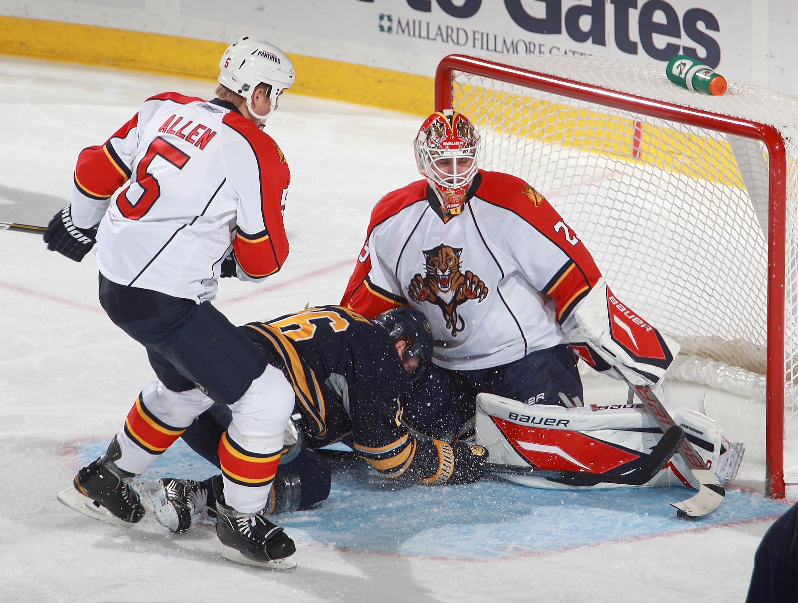 BUFFALO, NY - DECEMBER 23: Thomas Vanek #26  of the Buffalo Sabres slides into Tomas Vokoun #29 of the Florida Panthers as Bryan Allen #5 of the Panthers follows the play at HSBC Arena on December 23, 2010 in Buffalo, New York.  (Photo by Rick Stewart/Get