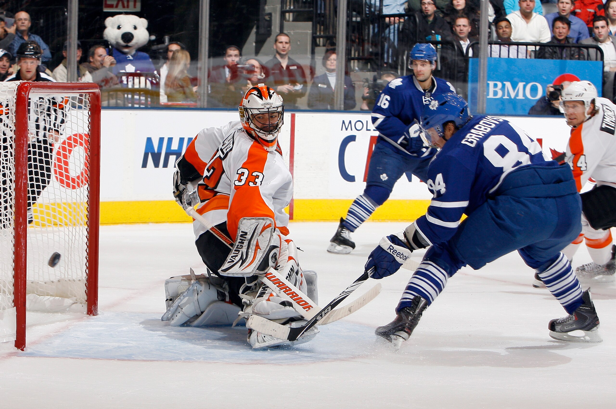 TORONTO, CANADA - DECEMBER 9: Mikhail Grabovski #84 of the Toronto Maple Leafs scores on Brian Boucher #33 of the Philadelphia Flyers during game action at the Air Canada Centre December 9, 2010 in Toronto, Ontario, Canada. (Photo by Abelimages/Getty Imag