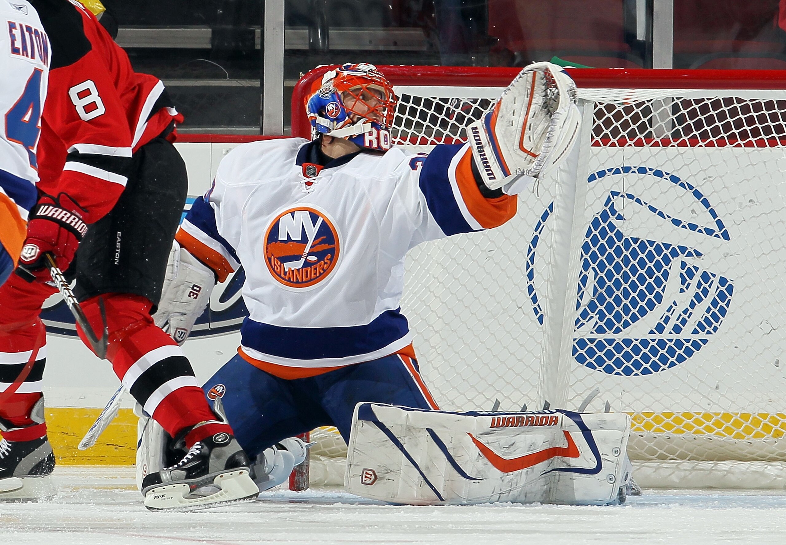 NEWARK, NJ - DECEMBER 23:  Dwayne Roloson #30 of the New York Islanders in action against the New Jersey Devils at the Prudential Center on December 23, 2010 in Newark, New Jersey.  (Photo by Jim McIsaac/Getty Images)