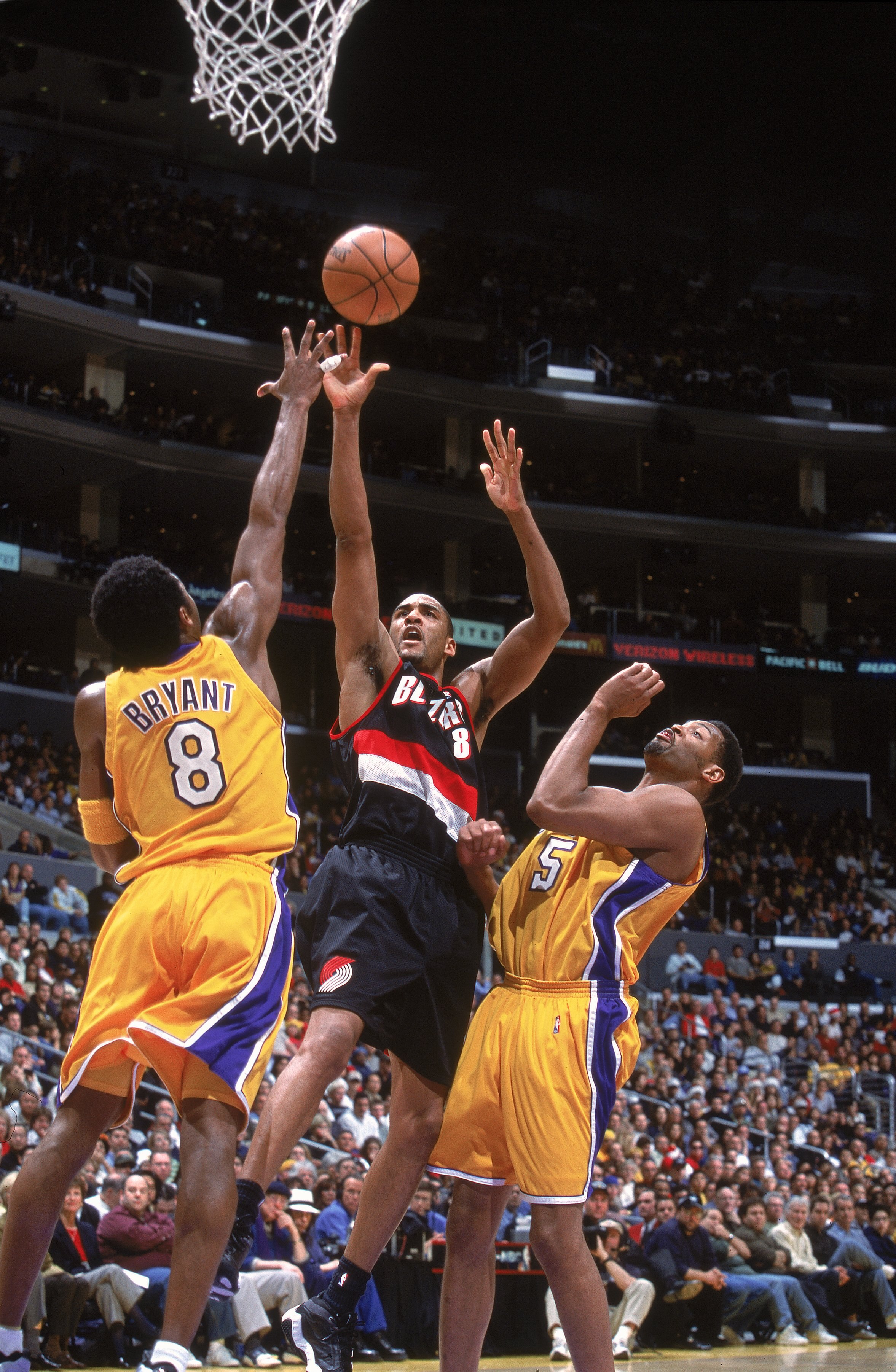 25 Dec 2000:  Steve Smith #8 of the Portland Trail Blazers takes a shot against Kobe Bryant #8 of the Los Angeles Lakers during the game at the STAPLES Center in Los Angeles, California. The Trail Blazers defeated the Lakers 109-104.   NOTE TO USER: It is