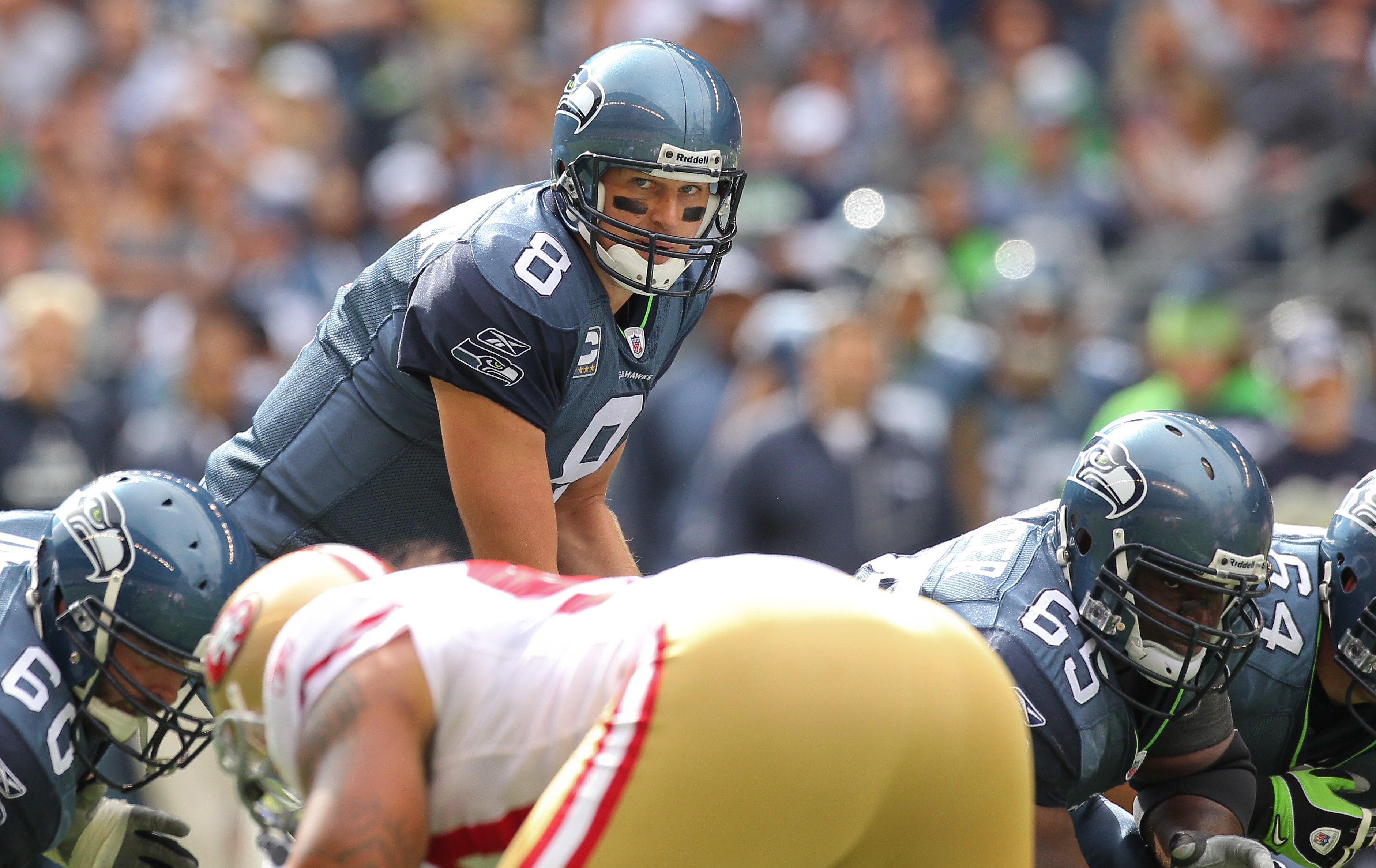 SEATTLE - SEPTEMBER 12:  Quarterback Matt Hasselbeck #8 of the Seattle Seahawks looks over the defense during the NFL season opener against the San Francisco 49ers at Qwest Field on September 12, 2010 in Seattle, Washington. (Photo by Otto Greule Jr/Getty