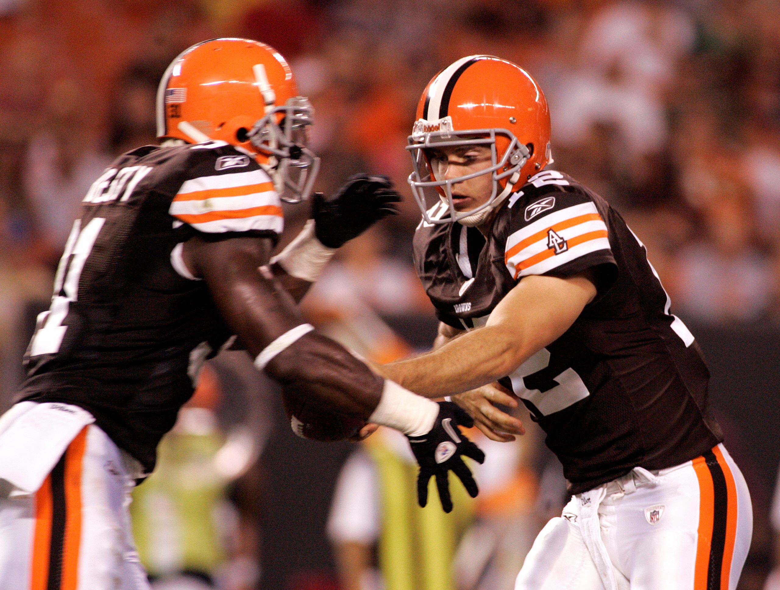 CLEVELAND - SEPTEMBER 2:  Colt McCoy #12 of the Cleveland Browns hands the ball off to Montario Hardesty #31 against the Chicago Bears during the preseason game on September 2, 2010 at Cleveland Browns Stadium in Cleveland, Ohio. The Browns defeated the B