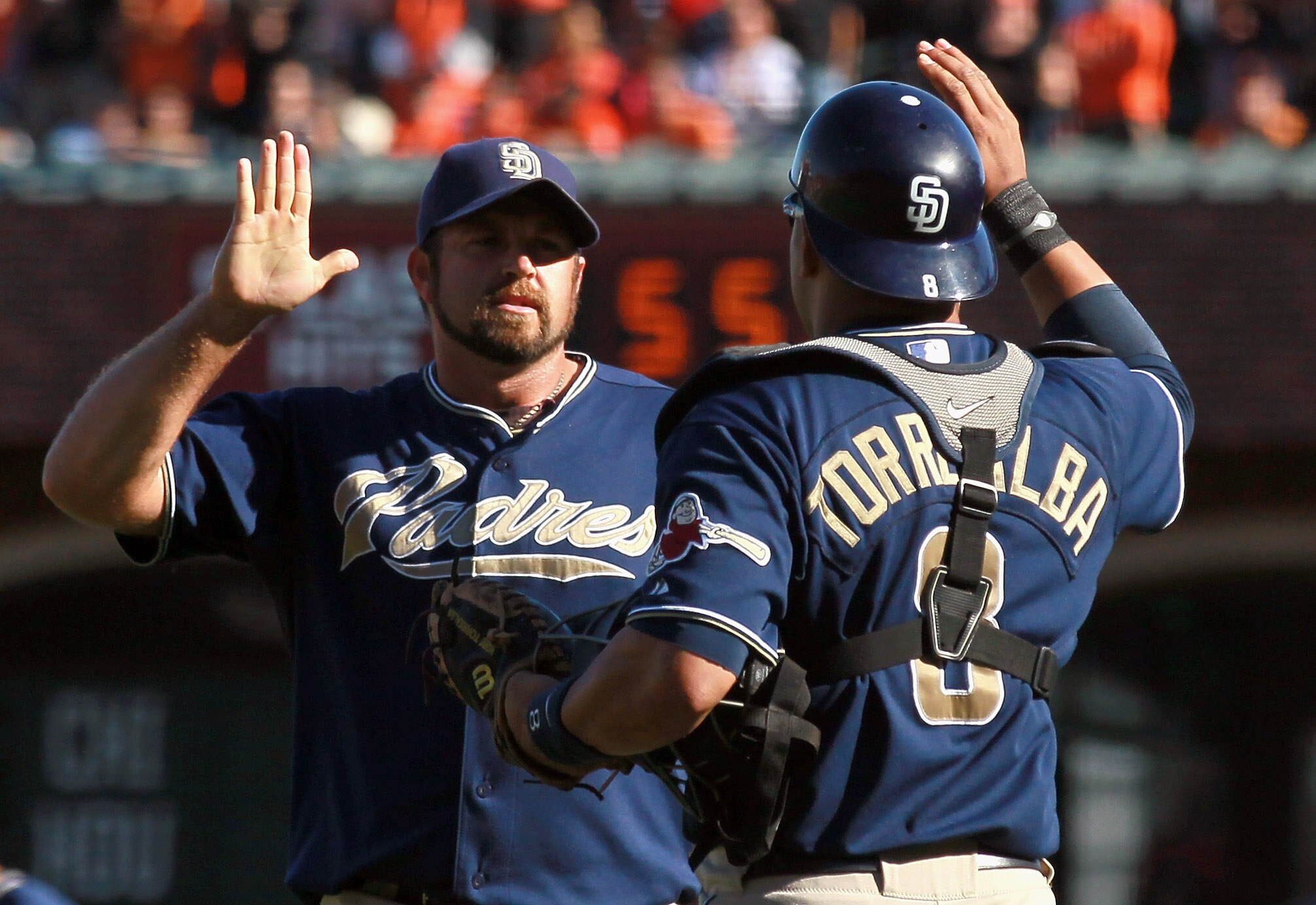 SAN FRANCISCO - OCTOBER 02:  Heath Bell #21 of the San Diego Padres is congratulated by teammate Yorvit Torrealba #8 at the end of the game against the San Francisco Giants at AT&T Park on October 2, 2010 in San Francisco, California. The Padres beat the