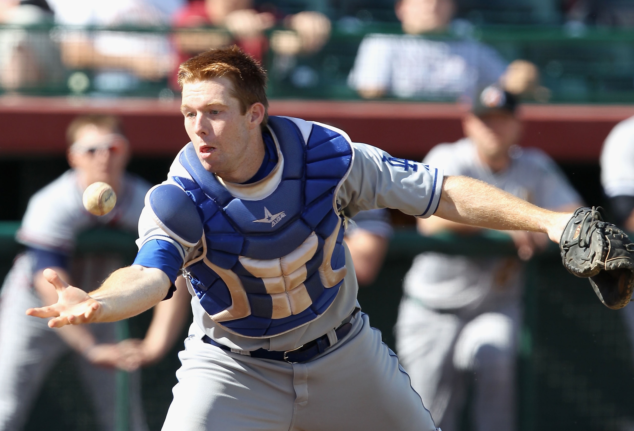 SCOTTSDALE, AZ - OCTOBER 23:  Los Angeles Dodgers prospect Matt Wallach #16 playing for the Phoenix Desert Dogs catches a fly ball out against the Scottsdale Scorpions during the AZ Fall League game at Scottsdale Stadium on October 23, 2010 in Scottsdale,
