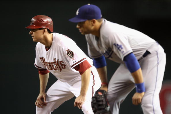 PHOENIX - SEPTEMBER 24:  Kelly Johnson #2 of the Arizona Diamondbacks leads off first base during the Major League Baseball game against the Los Angeles Dodgers at Chase Field on September 24, 2010 in Phoenix, Arizona.  (Photo by Christian Petersen/Getty