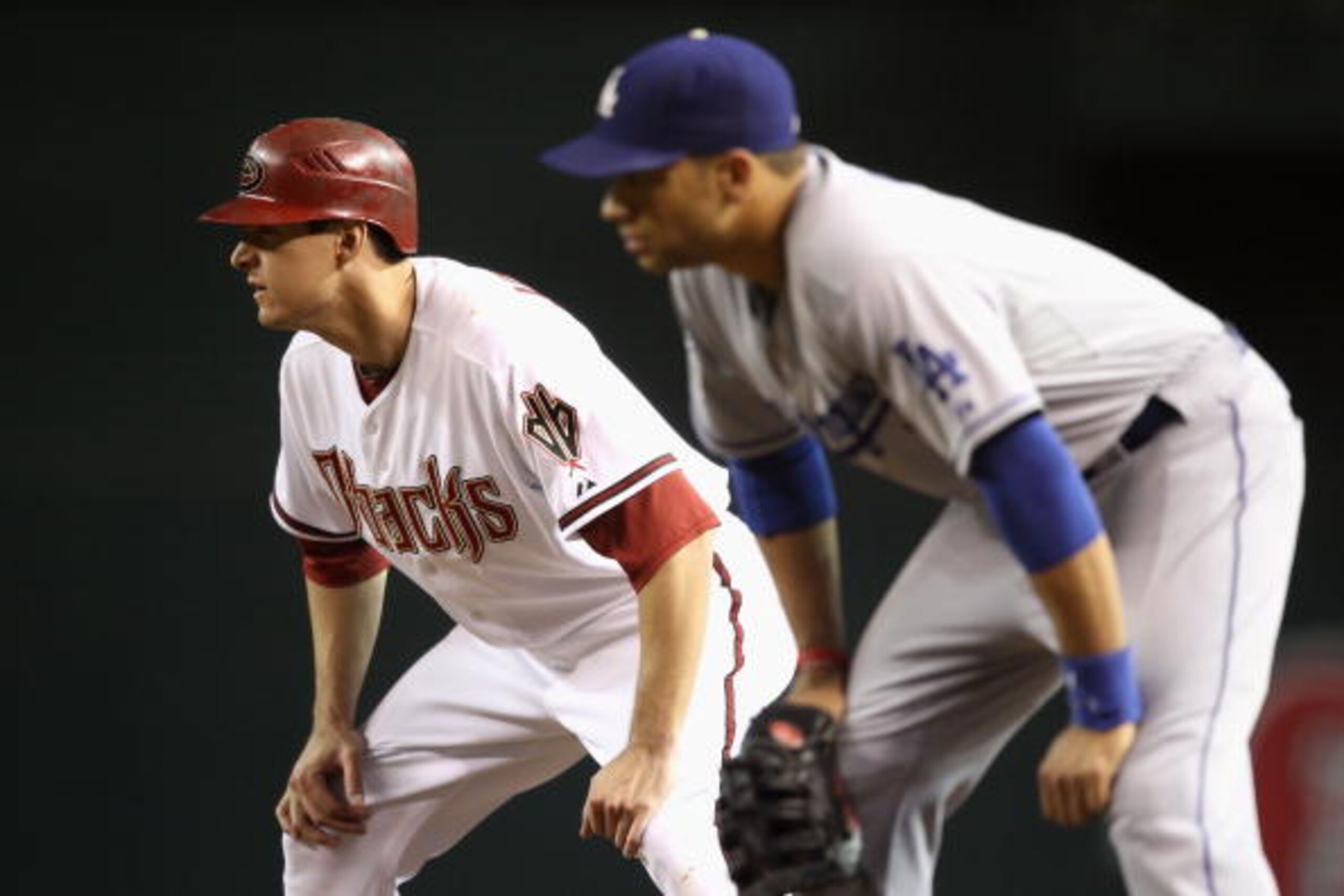 PHOENIX - SEPTEMBER 24:  Kelly Johnson #2 of the Arizona Diamondbacks leads off first base during the Major League Baseball game against the Los Angeles Dodgers at Chase Field on September 24, 2010 in Phoenix, Arizona.  (Photo by Christian Petersen/Getty