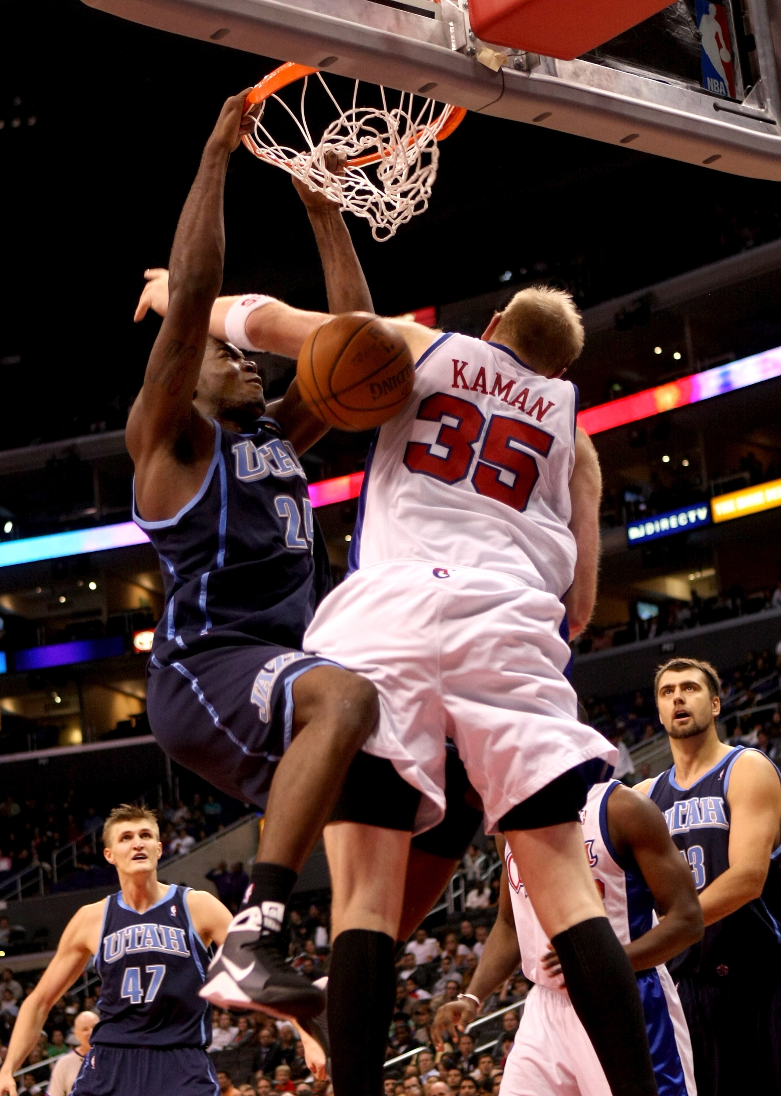 LOS ANGELES, CA - NOVEMBER 03:  Paul Millsap #24 of the Utah Jazz dunks over Chris Kaman #35 of the Los Angeles Clippers on November 3, 2008 at Staples Center in Los Angeles, California. The Jazz won 89-73.  NOTE TO USER: User expressly acknowledges and a