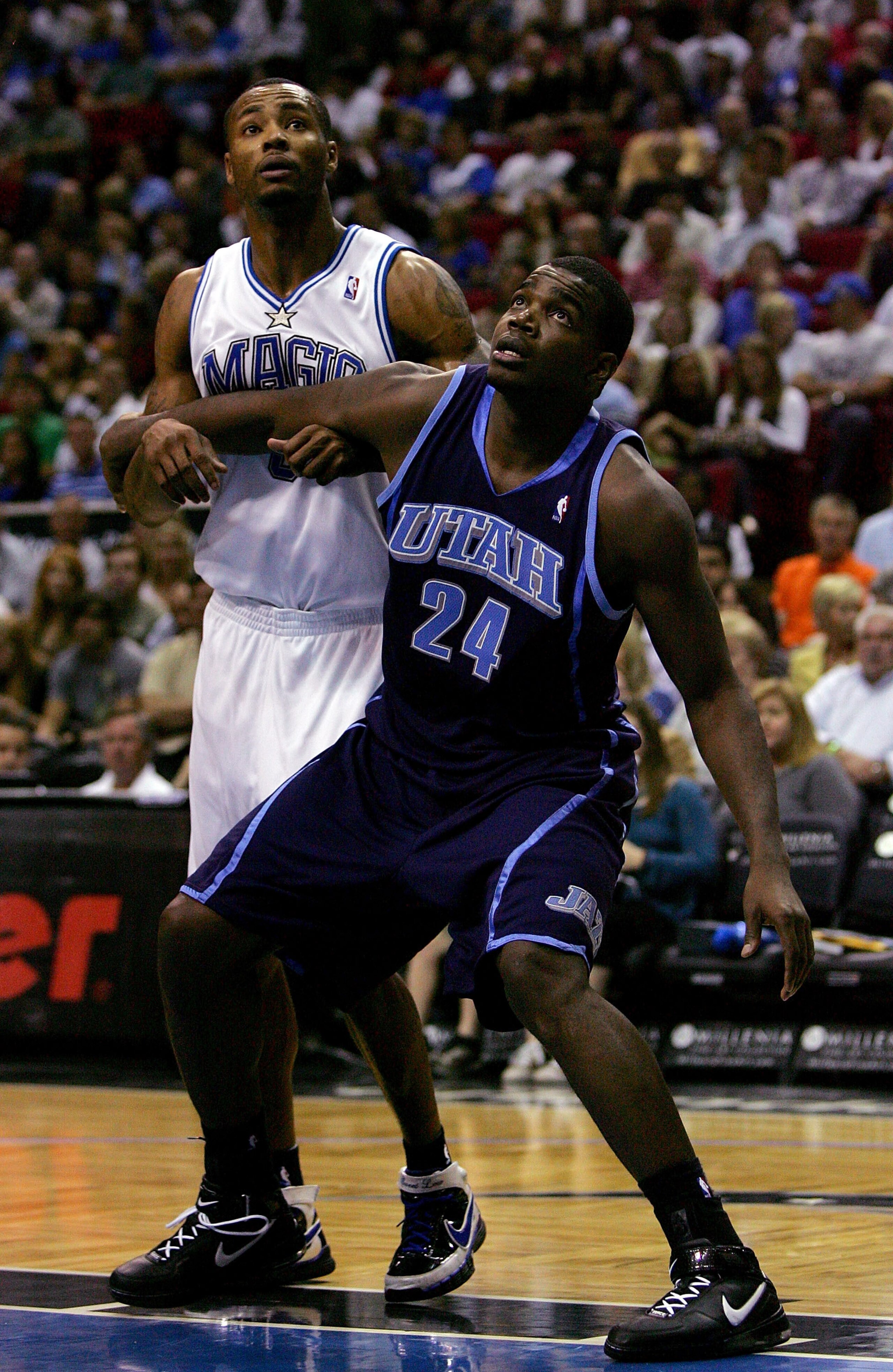 ORLANDO, FL - DECEMBER 21:  Paul Millsap #24 of the Utah Jazz battles for a rebound against Rashard Lewis #9 of the Orlando Magic at Amway Arena December 21, 2007 in Orlando Florida. NOTE TO USER: User expressly acknowledges and agrees that, by downloadin