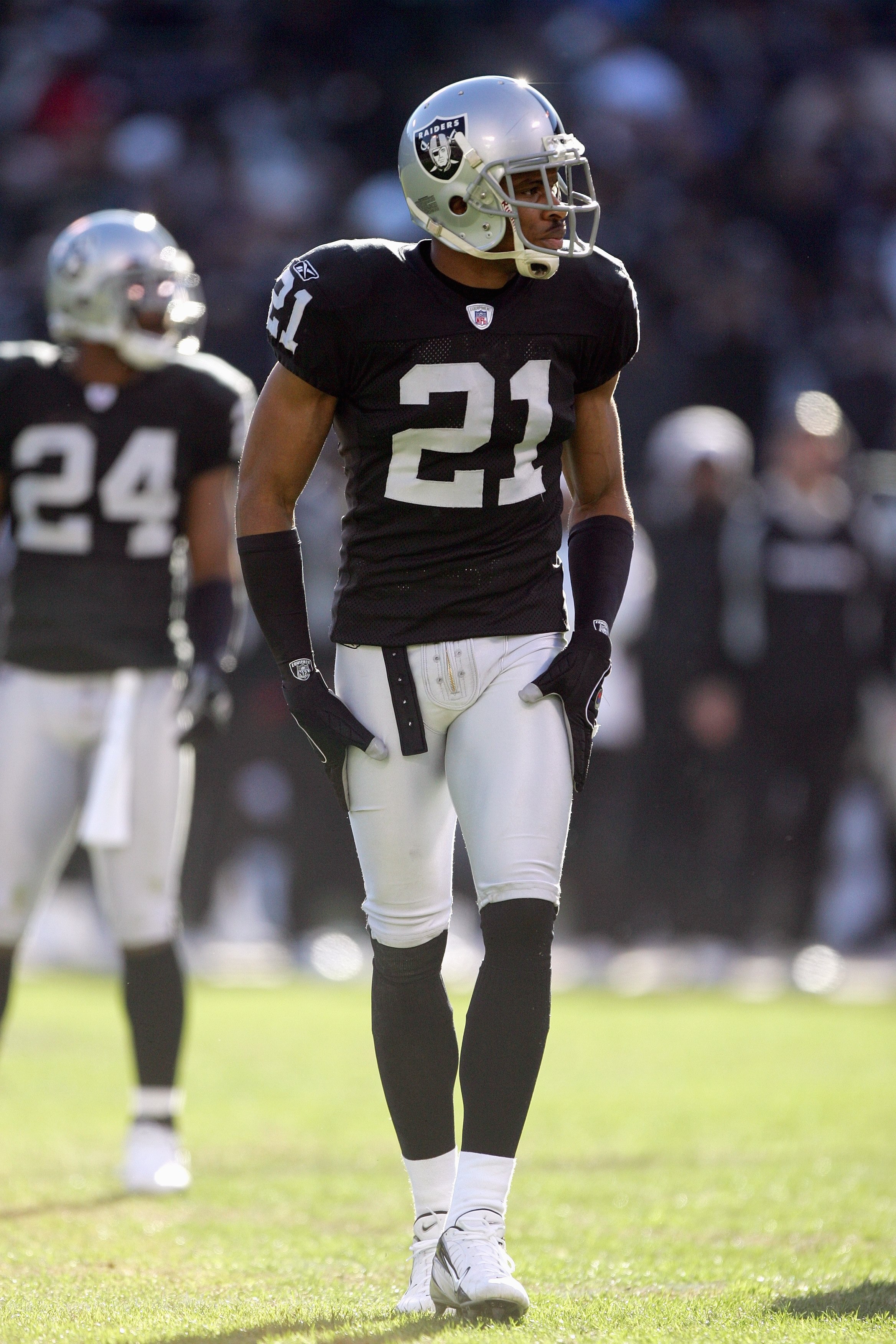 OAKLAND, CA - DECEMBER 17: Nnamdi Asomugha #21 of the Oakland Raiders walks on the field during an NFL game against the St. Louis Rams at McAfee Coliseum December 17, 2006 in Oakland, California. (Photo by Jed Jacobsohn/Getty Images)