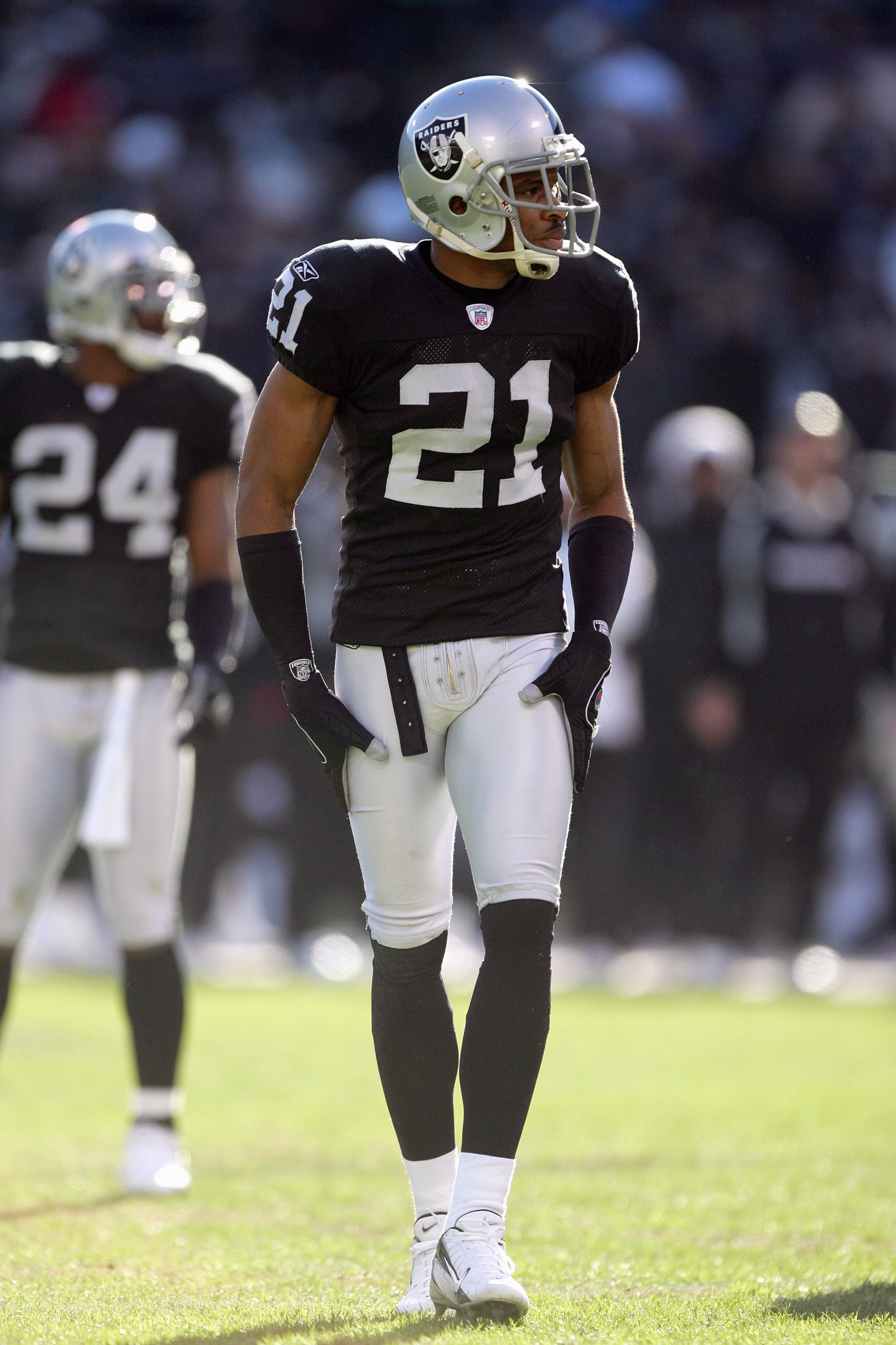 OAKLAND, CA - DECEMBER 17: Nnamdi Asomugha #21 of the Oakland Raiders walks on the field during an NFL game against the St. Louis Rams at McAfee Coliseum December 17, 2006 in Oakland, California. (Photo by Jed Jacobsohn/Getty Images)